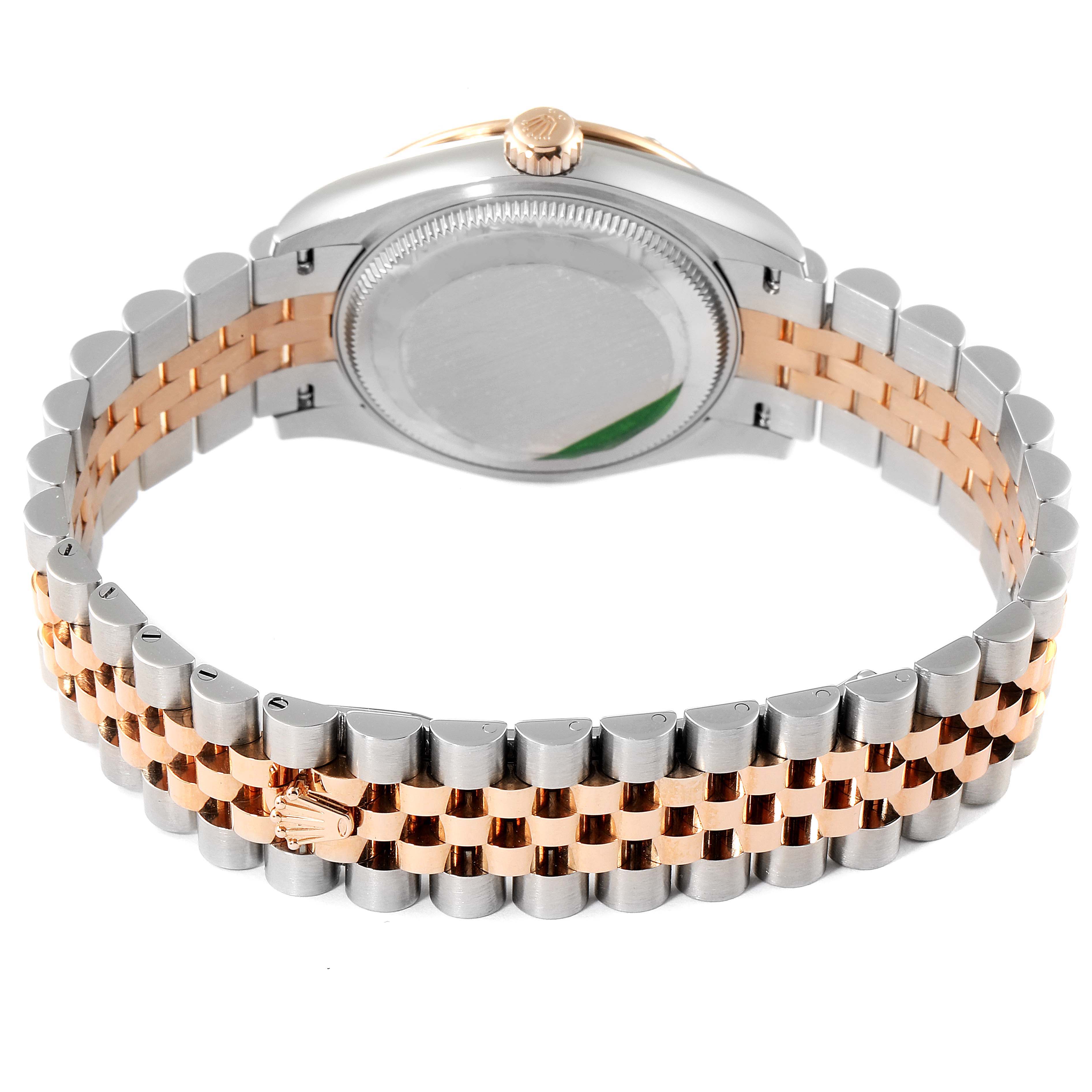 This image shows the backside and bracelet of a Mid-Size Rolex watch, focusing on the case back and the two-tone metal strap.