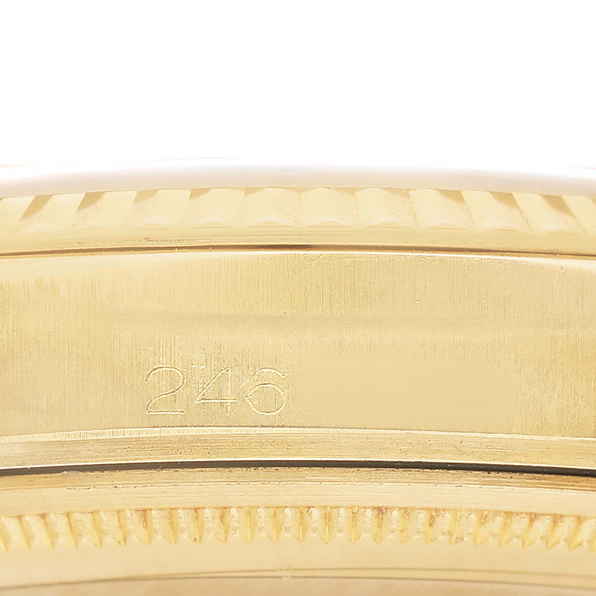 The image shows the side engraving on the case of a Rolex Vintage Collection 1601 Men's Yellow Gold Champagne Dial watch, highlighting the serial number.