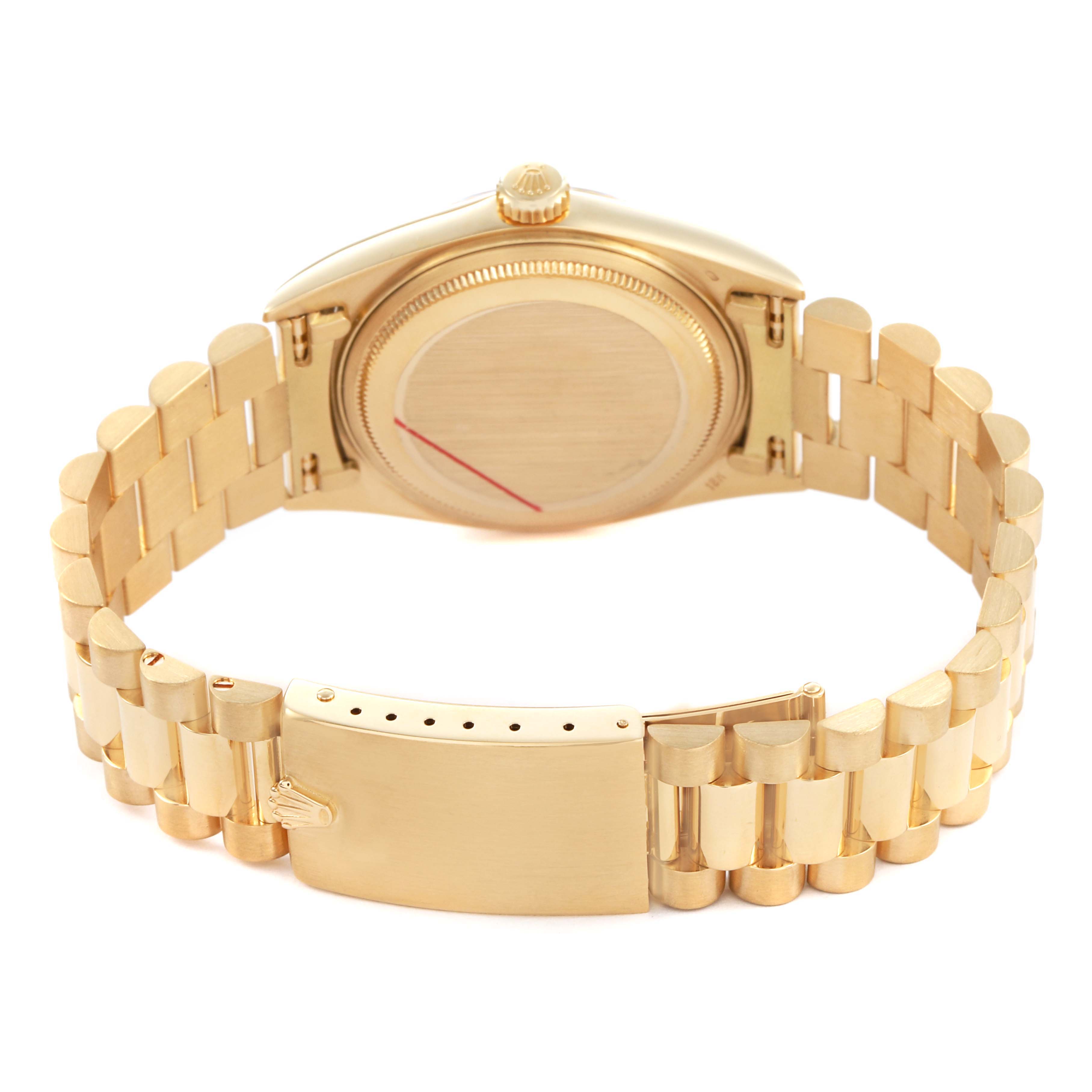 The Rolex Vintage Collection 1601 Men's Yellow Gold Champagne Dial watch is shown from the back, highlighting the case back, bracelet, and clasp.