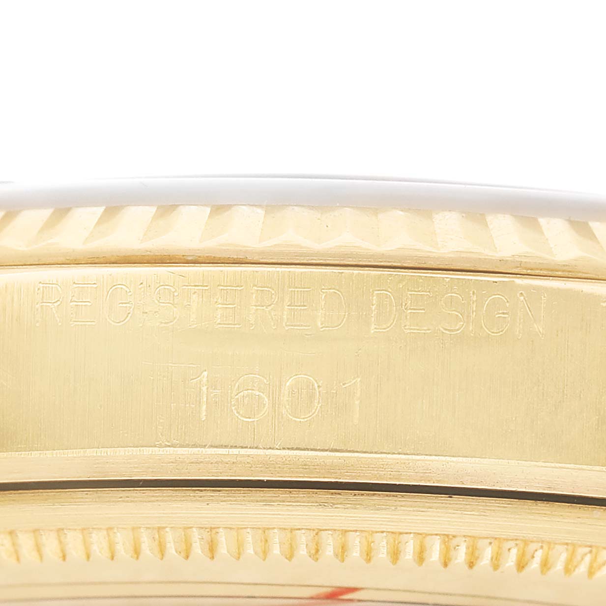 The image shows the side case with engraved model number 1601 of the Rolex Vintage Collection 1601 Men's Yellow Gold Champagne Dial watch.
