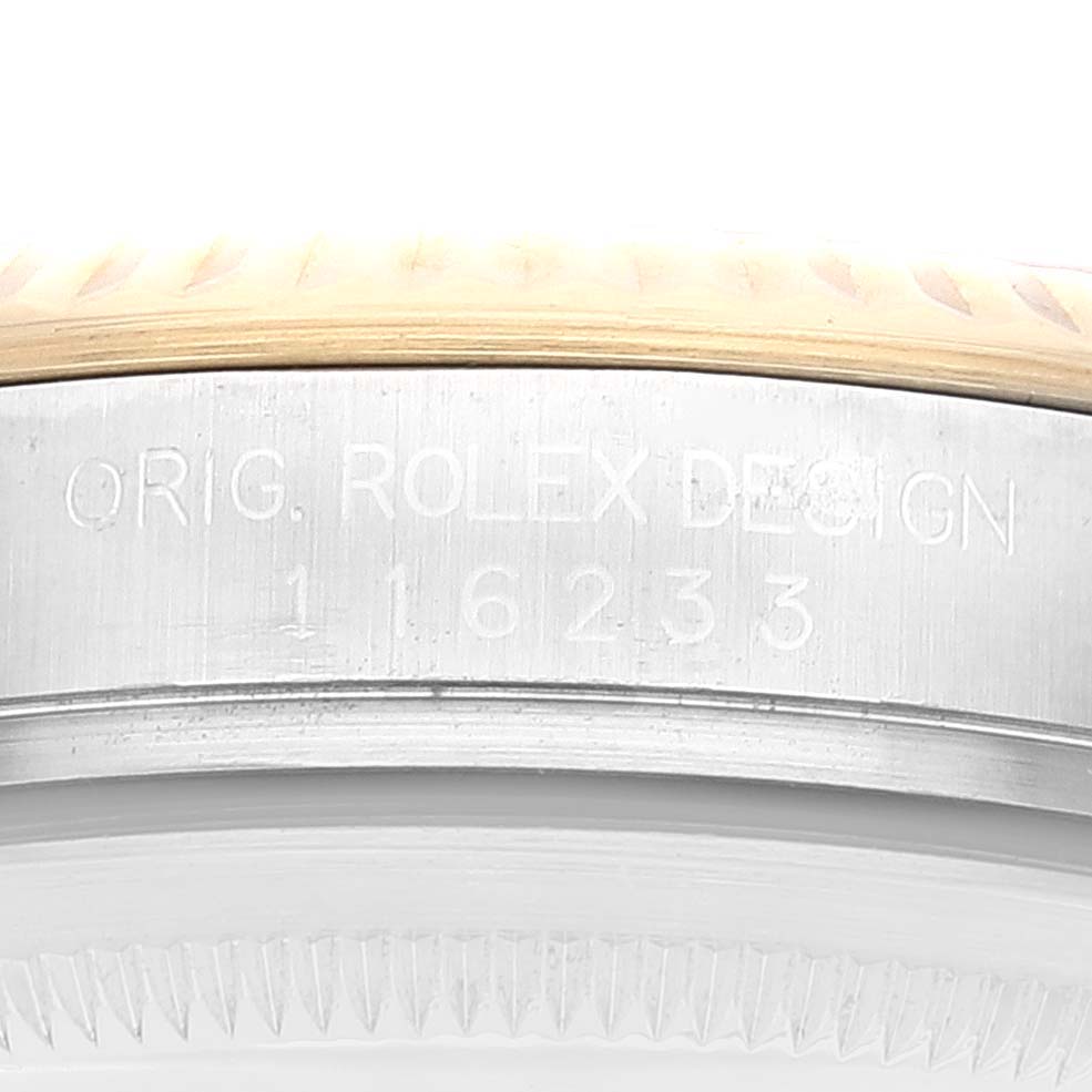 This image shows a close-up of the side of the Rolex Datejust 116233 Men's Steel and Gold (two tone) Grey Dial 116233 Men's Steel and Gold (two tone) Grey Dial watch case, focusing on the model number engraving.