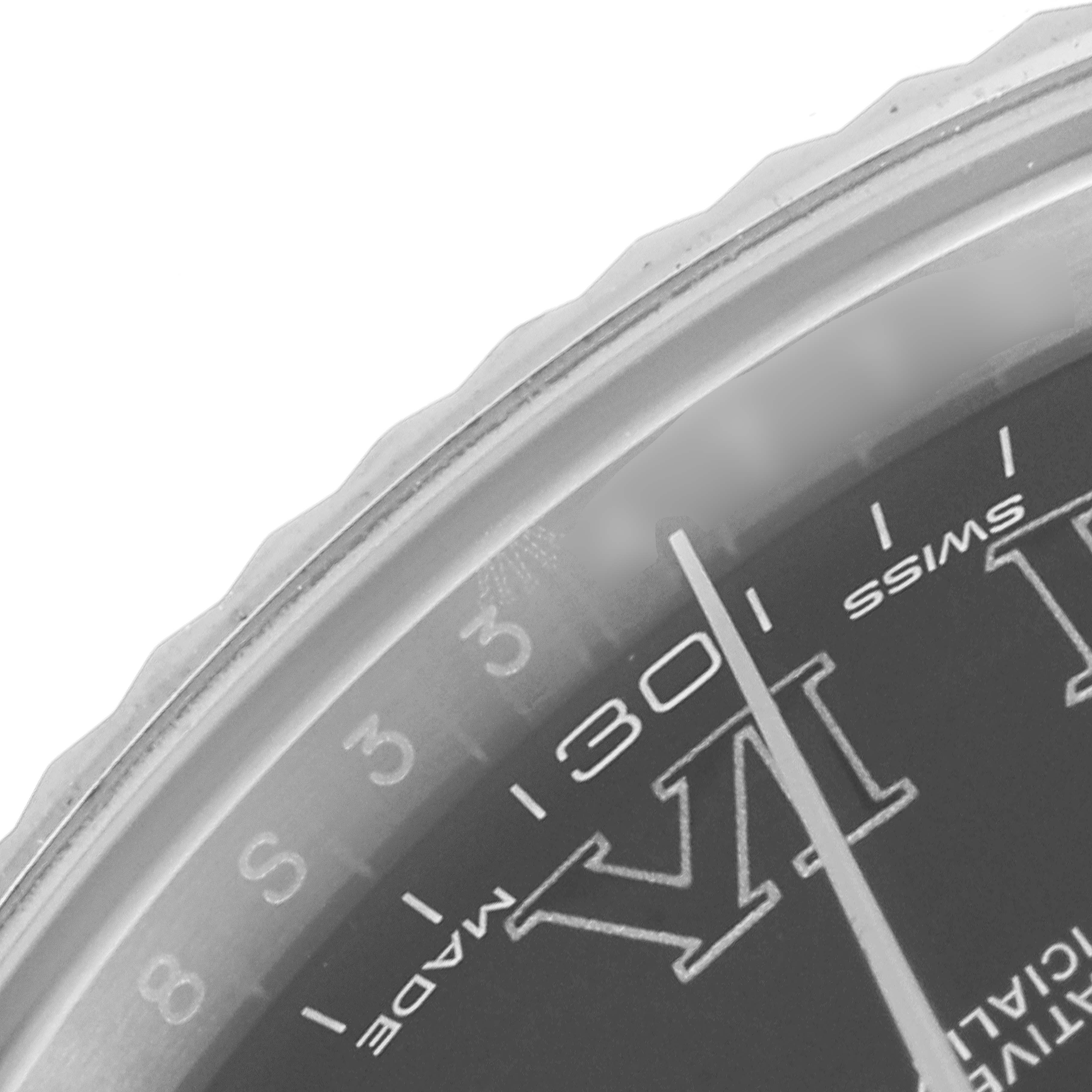This close-up image of a Rolex Datejust 41 116334 Men's Stainless Steel Grey Dial 116334 Men's Stainless Steel Grey Dial watch shows the bezel's edge, part of the dial, and the "Swiss Made" text.