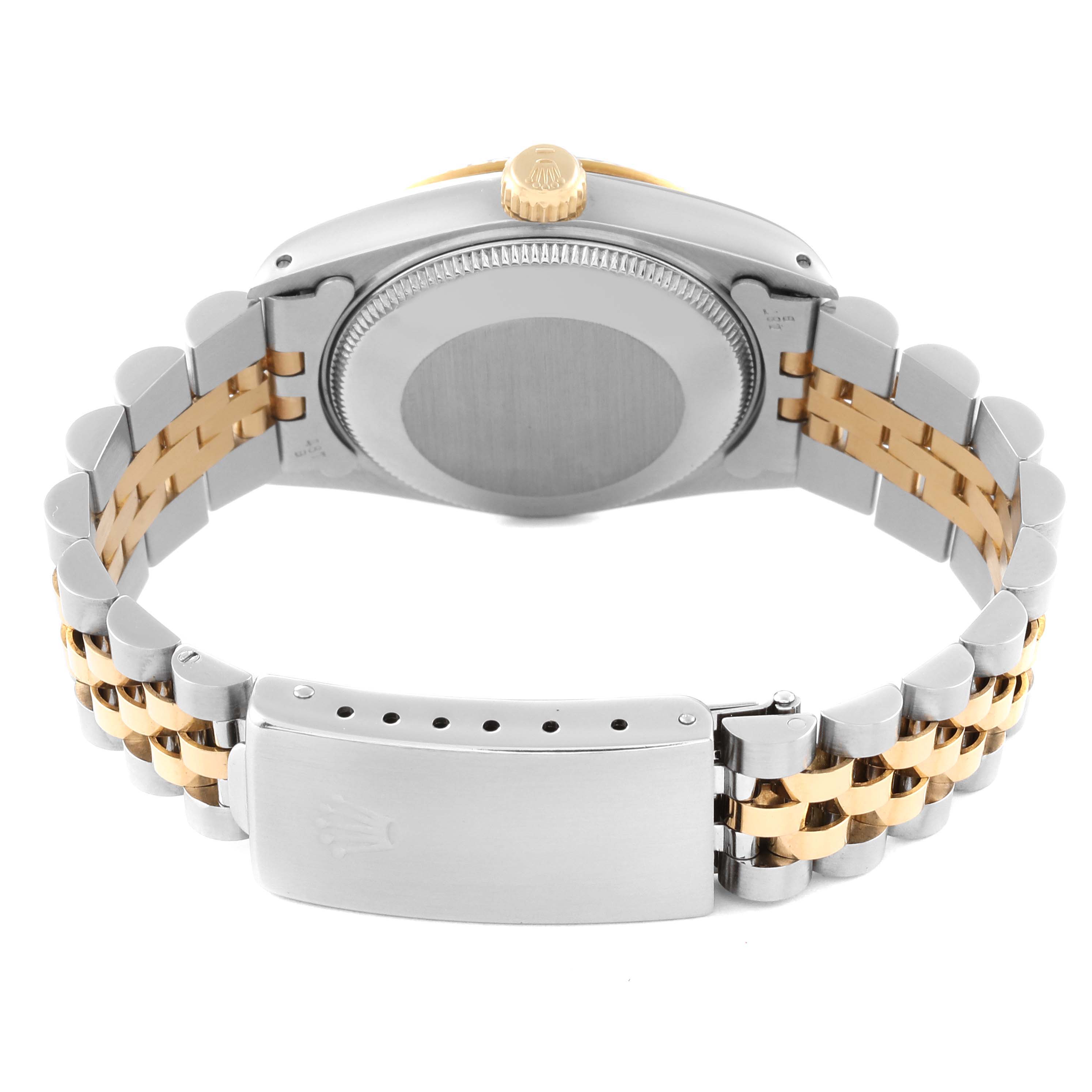 This image shows the back view of a Mid-Size Rolex watch, focusing on the case back, bracelet, and clasp.