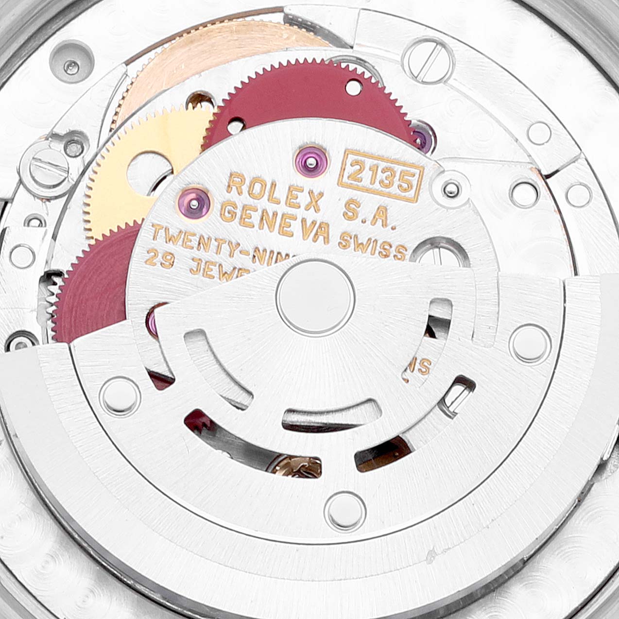 The image shows a close-up of the movement mechanism for a mid-size Rolex watch model 2135.