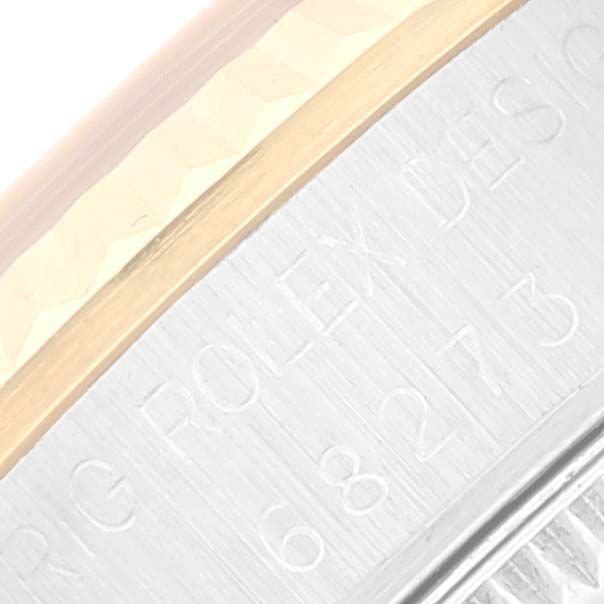 This image shows a close-up of the side of a Rolex Mid-Size 68273 Women's Steel and Gold (two tone) Black Dial 68273 Women's Steel and Gold (two tone) Black Dial watch, highlighting the engraved reference number.
