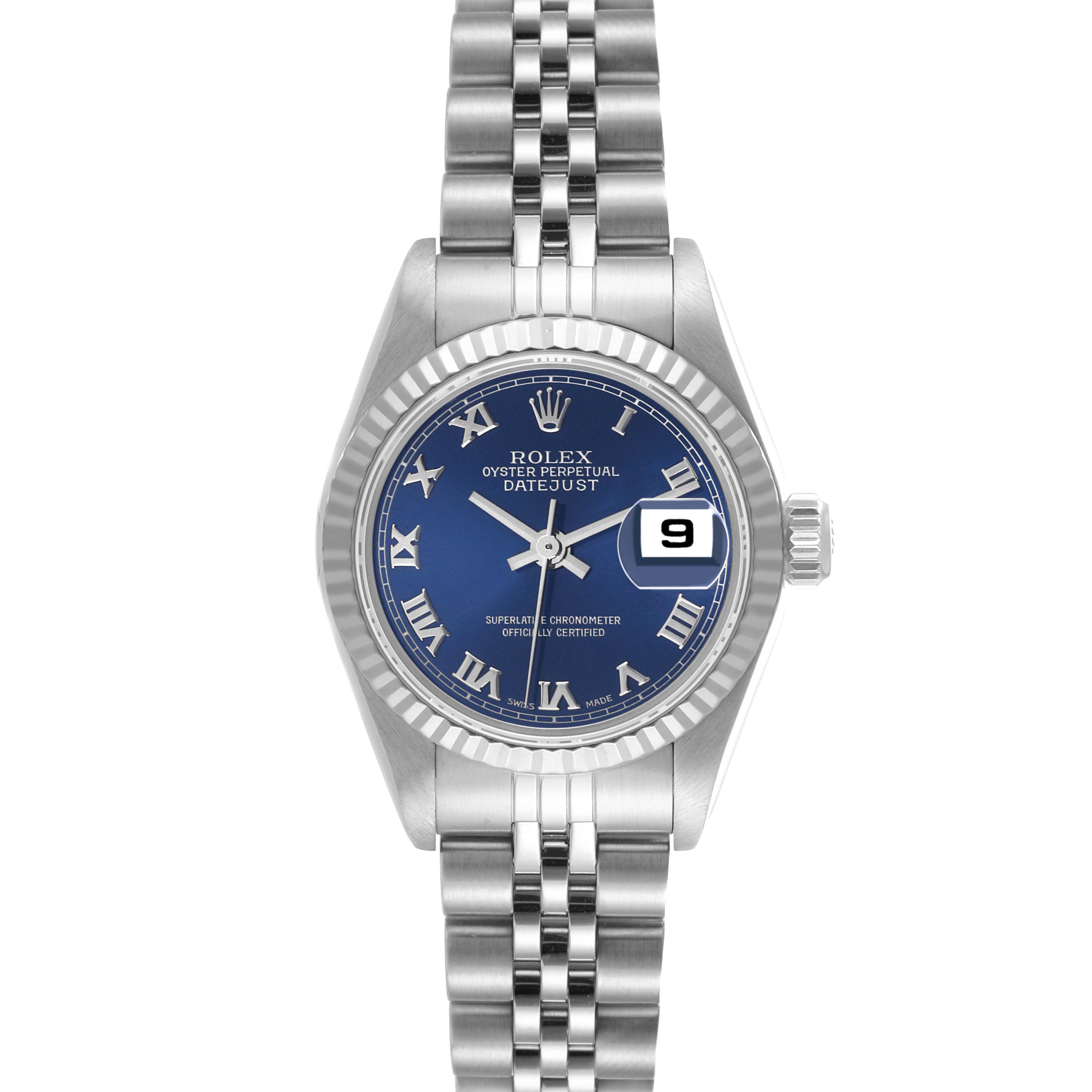 The image shows a frontal view of a Rolex Datejust 79174 Women's Stainless Steel Blue Dial 79174 Women's Stainless Steel Blue Dial watch with a blue dial and roman numerals, silver bracelet, and date complication.