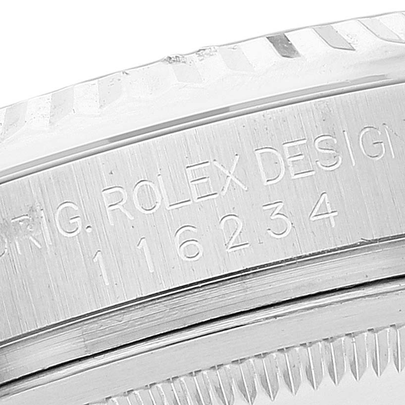 This close-up image shows the side case engraving and partially the bezel of a Rolex Datejust 116234 Men's Stainless Steel Silver Dial 116234 Men's Stainless Steel Silver Dial watch.