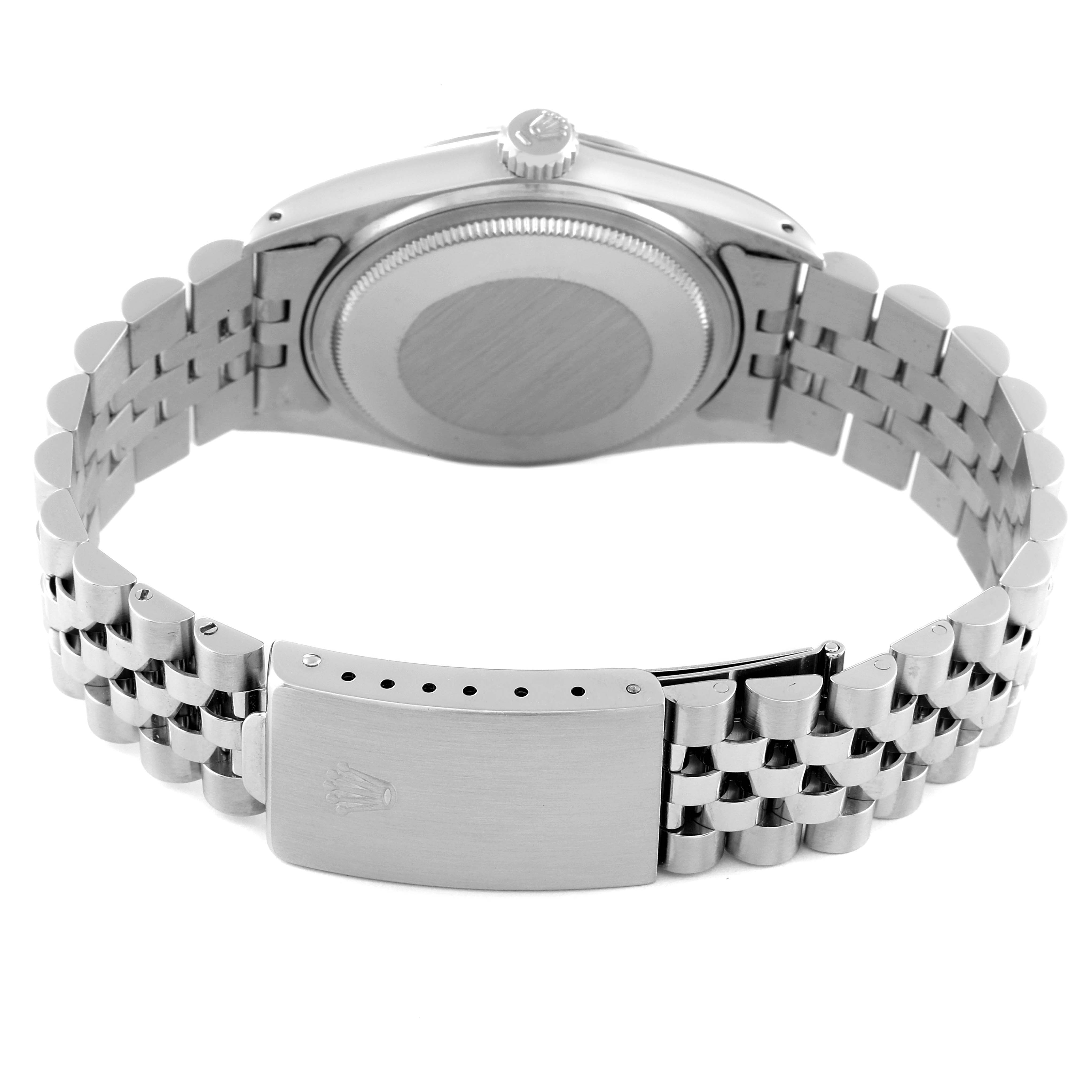 The image shows the back case, crown, and bracelet clasp of a Vintage Collection model by Rolex.