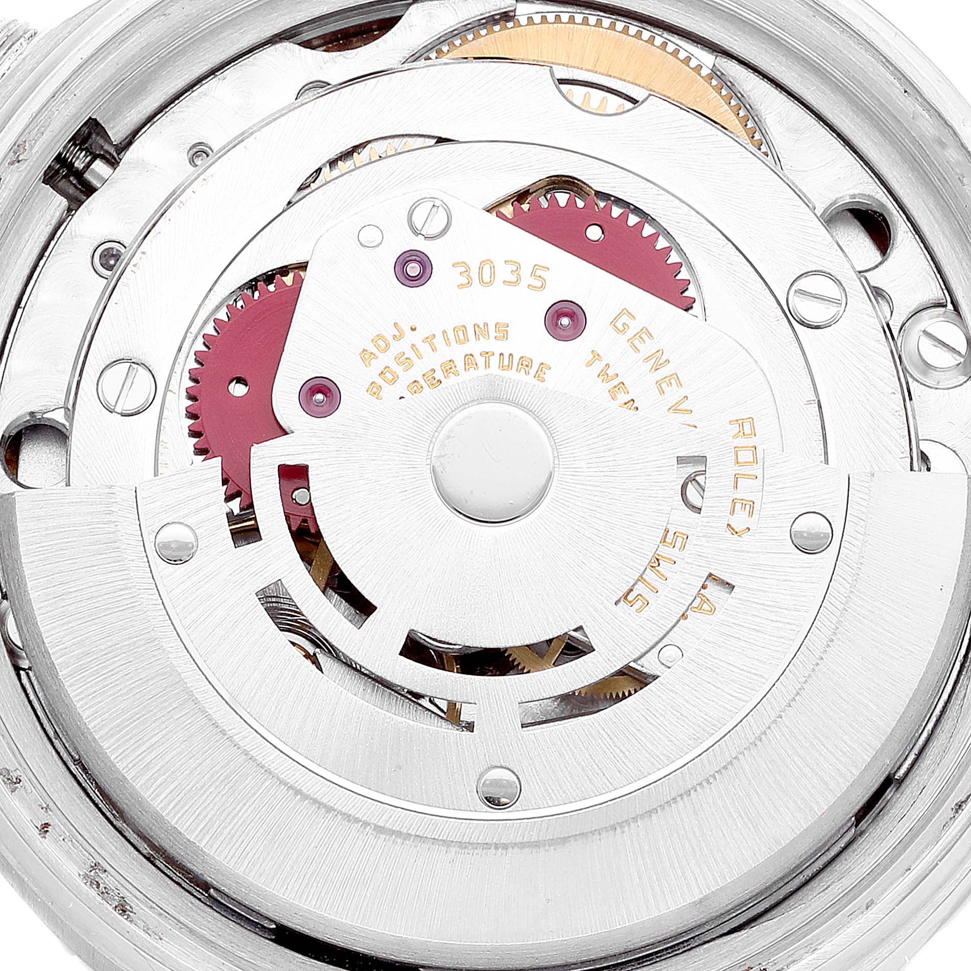 This image shows the inner mechanical movement of a Vintage Collection Rolex model, featuring gears and the rotor.