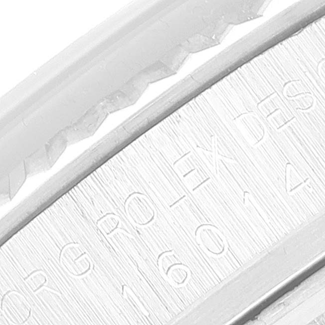 The image shows a close-up view of the engraved details on the side of a Vintage Collection Rolex watch.