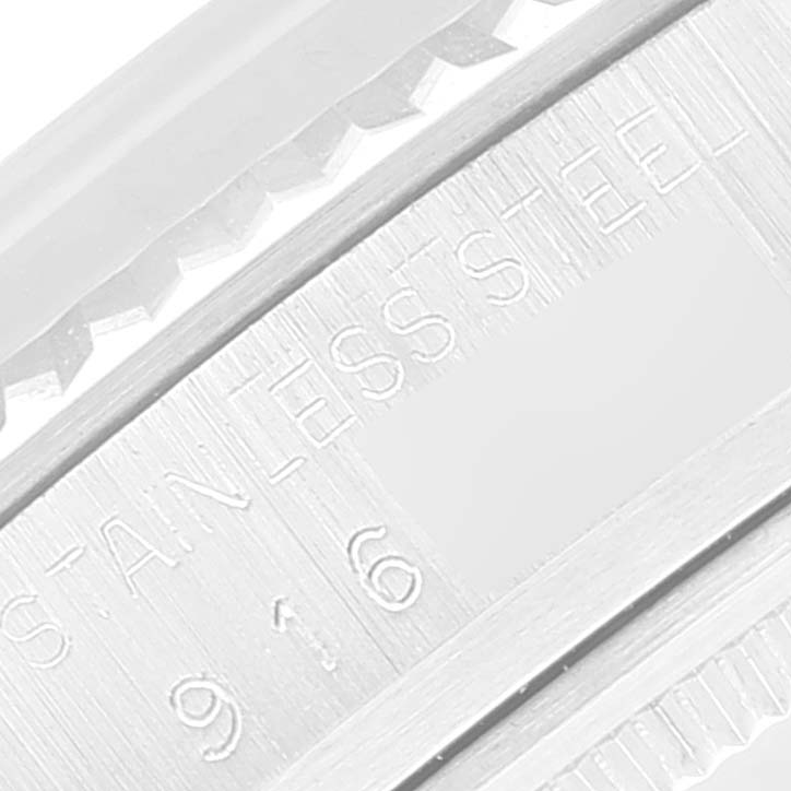 This image shows a close-up of the brushed stainless steel casing and bezel edge of the Rolex Vintage Collection 16014 Men
s Stainless Steel Silver Dial 16014 Men
s Stainless Steel Silver Dial model.