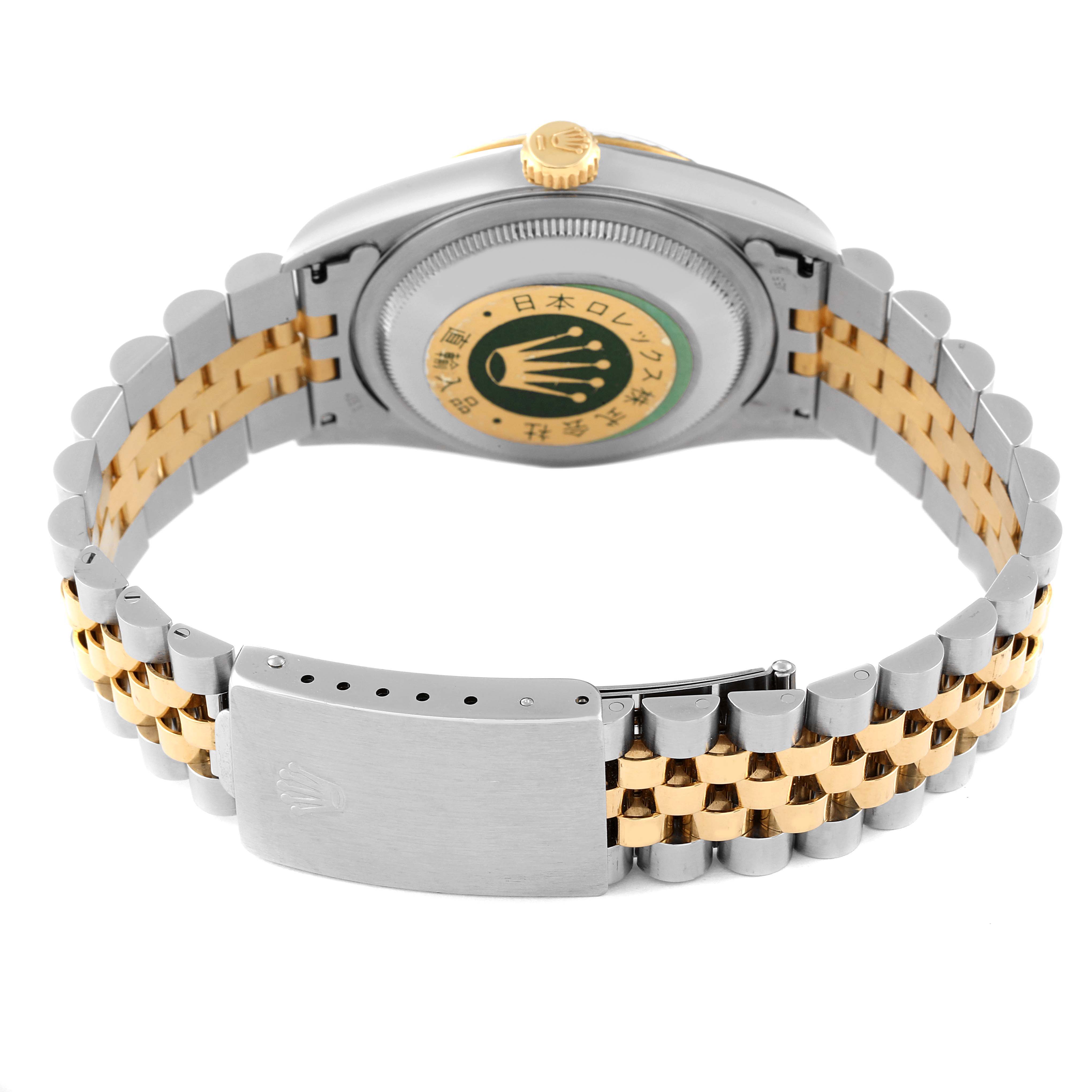 The image shows the case back and clasp of a Rolex Datejust 16233 Men's Steel and Gold (two tone) Black Dial 16233 Men's Steel and Gold (two tone) Black Dial watch, highlighting its bi-tone bracelet and engravings.