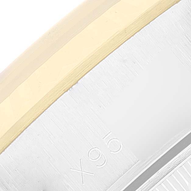 The image shows a close-up of the edge of the bezel and case with engraved numbers on a Rolex Datejust 69173 Women
s Steel and Gold (two tone) Blue Dial 69173 Women
s Steel and Gold (two tone) Blue Dial watch.