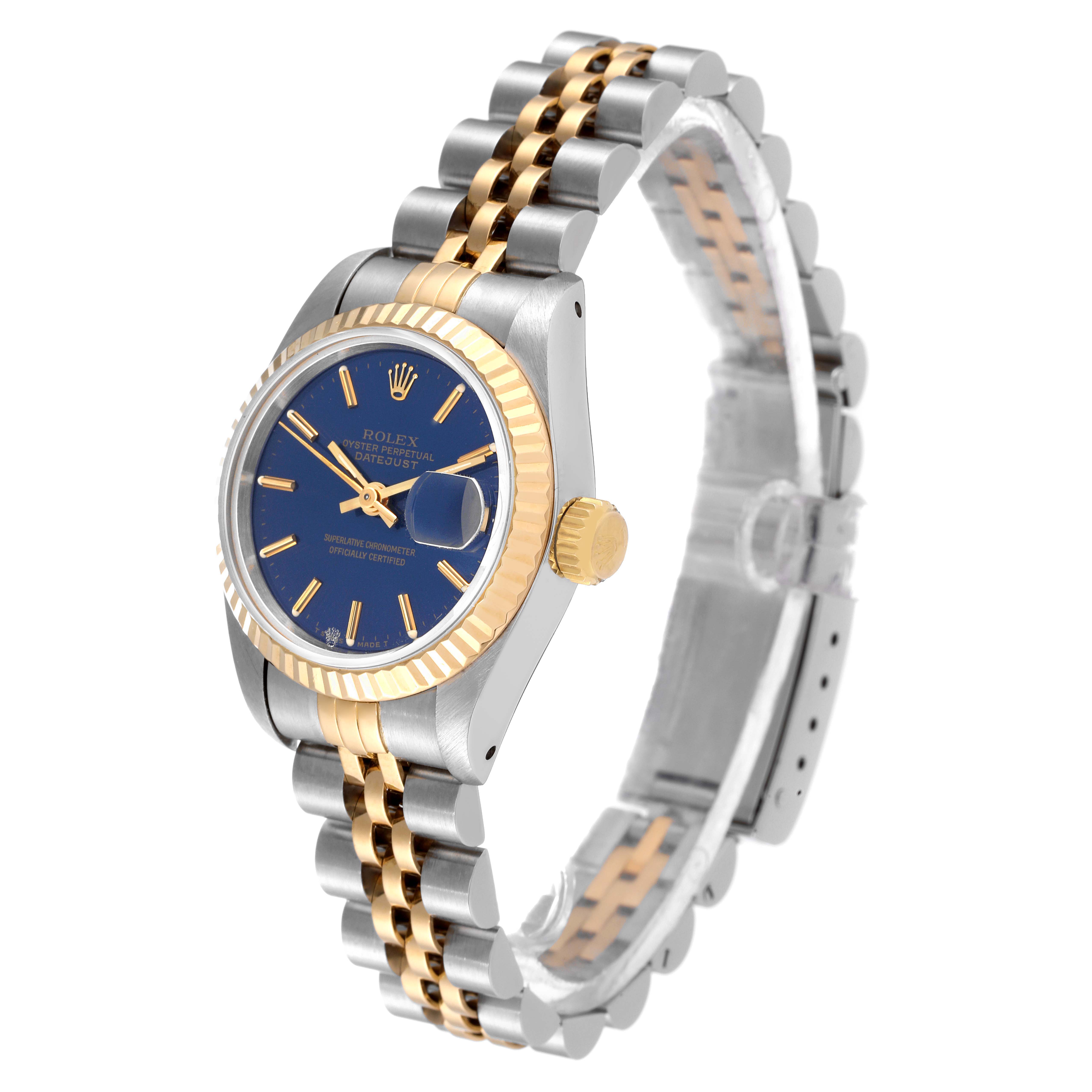 The Rolex Datejust 69173 Women
s Steel and Gold (two tone) Blue Dial 69173 Women
s Steel and Gold (two tone) Blue Dial watch is shown at a three-quarter angle, highlighting its blue dial, date window, fluted bezel, and two-tone bracelet.