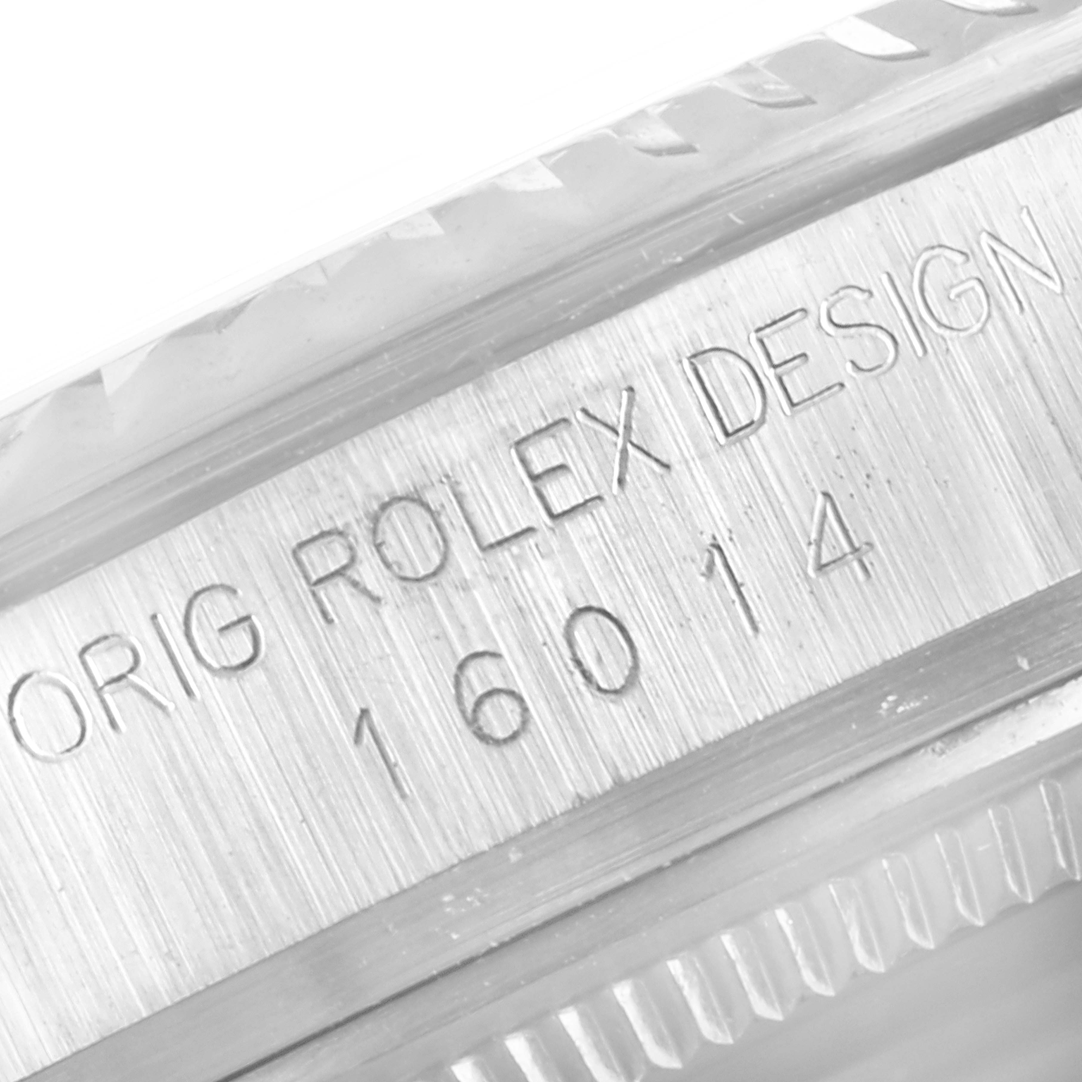 The image shows a close-up of the engraved serial number and "ORIG ROLEX DESIGN" on the side of a Rolex Vintage Collection 16014 Men's Stainless Steel Black Dial 16014 Men's Stainless Steel Black Dial model.