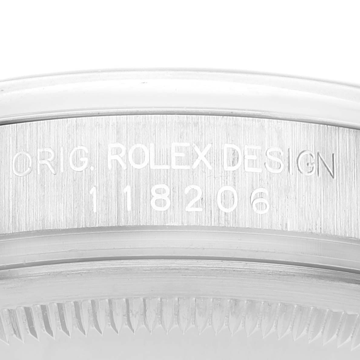 This image shows a close-up of the case engraving and outer edge of a Rolex President 118206 Men's Platinum Blue Dial 118206 Men's Platinum Blue Dial model watch.