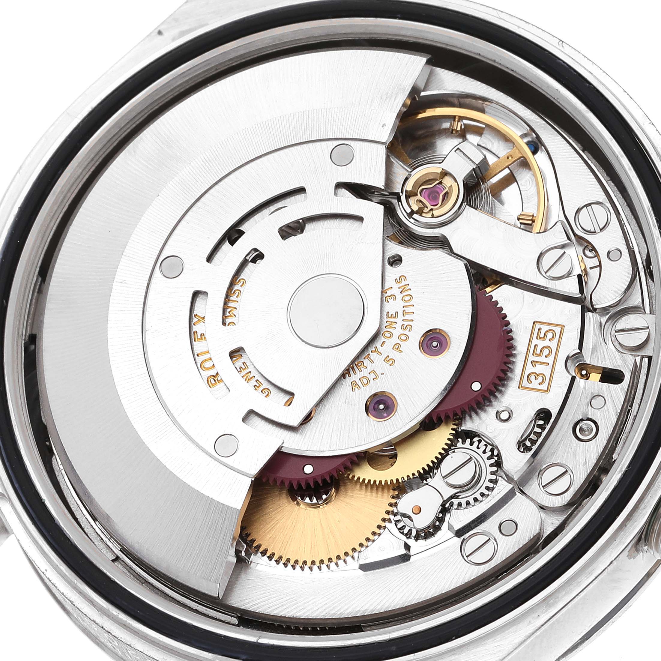 The image shows an overhead view of the Rolex President 118206 Men's Platinum Blue Dial 118206 Men's Platinum Blue Dial model's intricate mechanical movement and internal components.