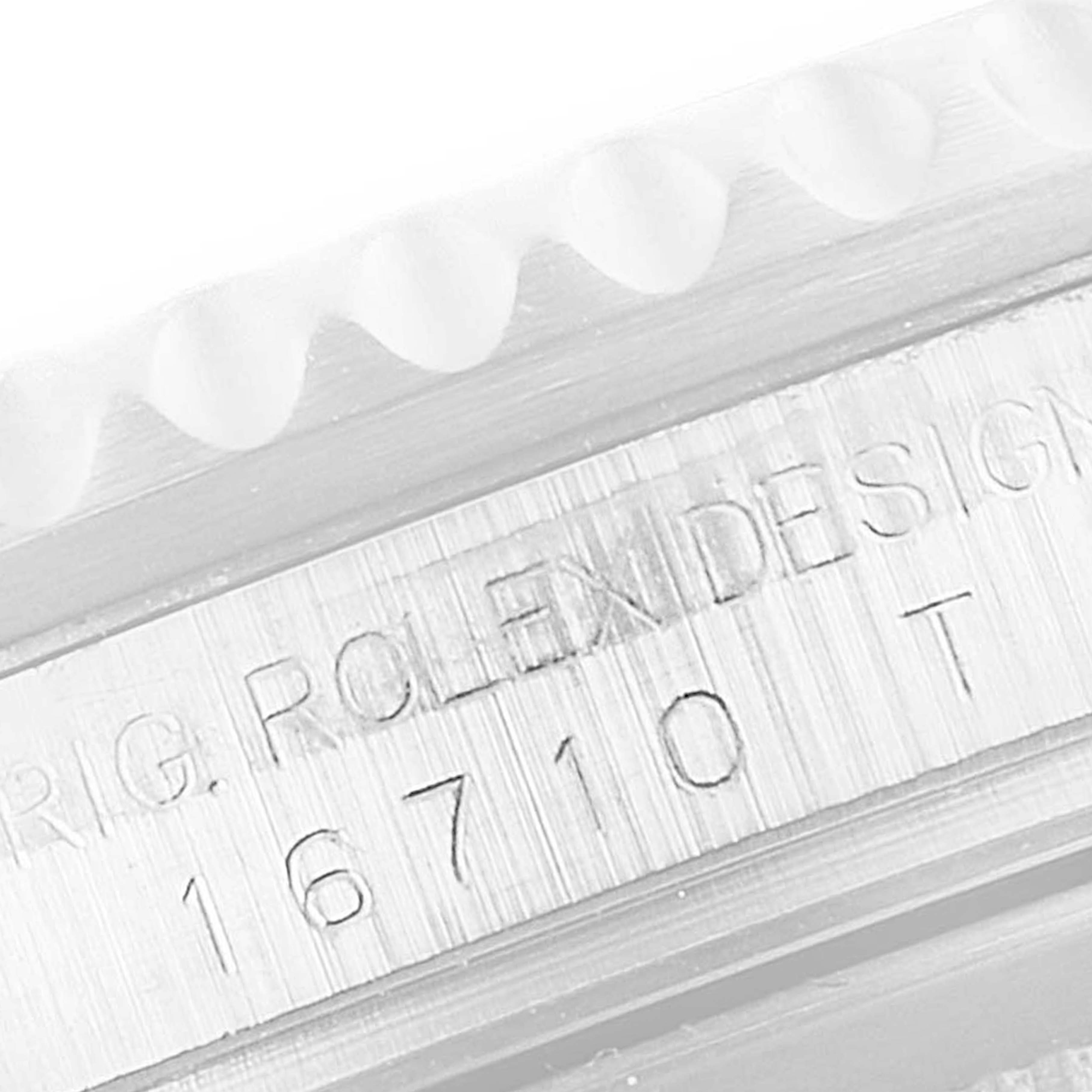 This close-up image shows the side engraving and edge of the bezel of a Rolex GMT-Master 16710 Men
s Stainless Steel Black Dial 16710 Men
s Stainless Steel Black Dial watch.