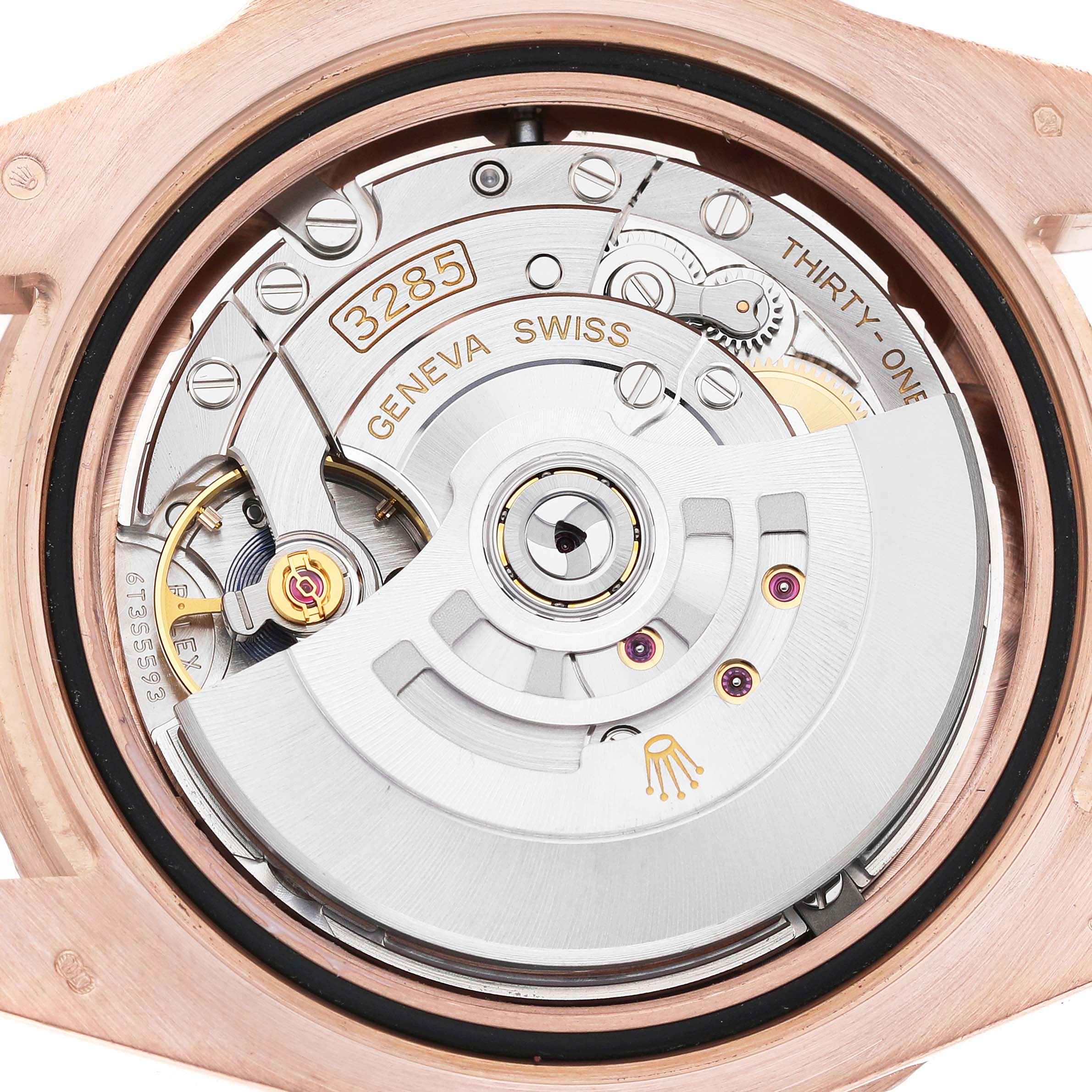 The image shows the movement of a Rolex GMT-Master 126715 Men's Rose Gold Black Dial, viewed from the back, highlighting the rotor and intricate mechanics.