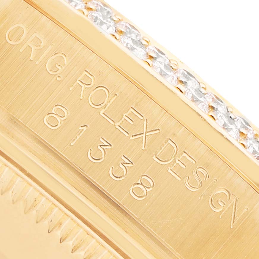 The image shows a close-up of the side of a Rolex Pearlmaster 81338 Women's Yellow Gold White Dial watch, highlighting the engraved design numbers.