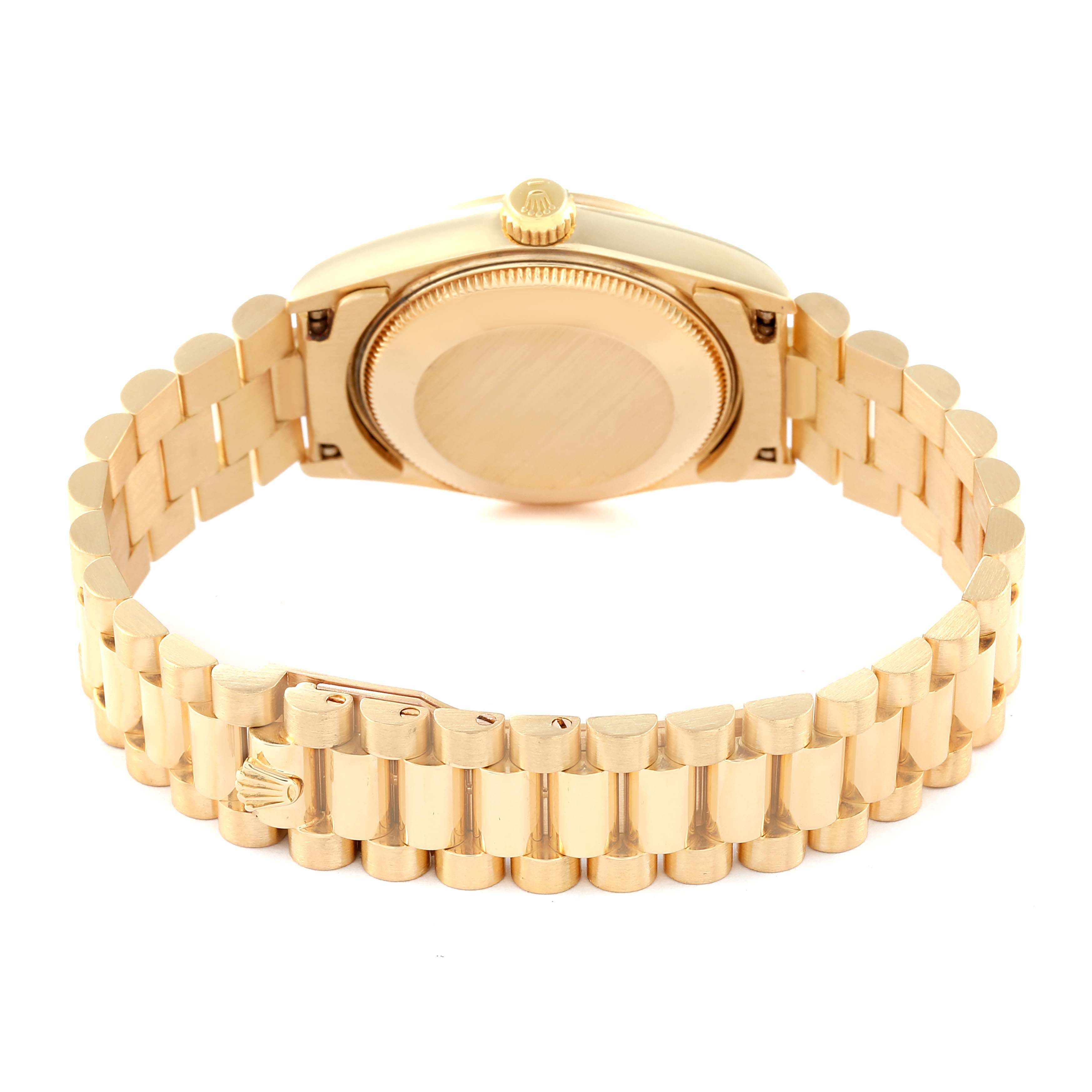 The image shows the underside of a Rolex President 68278 Women's Yellow Gold Champagne Dial 68278 Women's Yellow Gold Champagne Dial model watch featuring its case back and bracelet links.