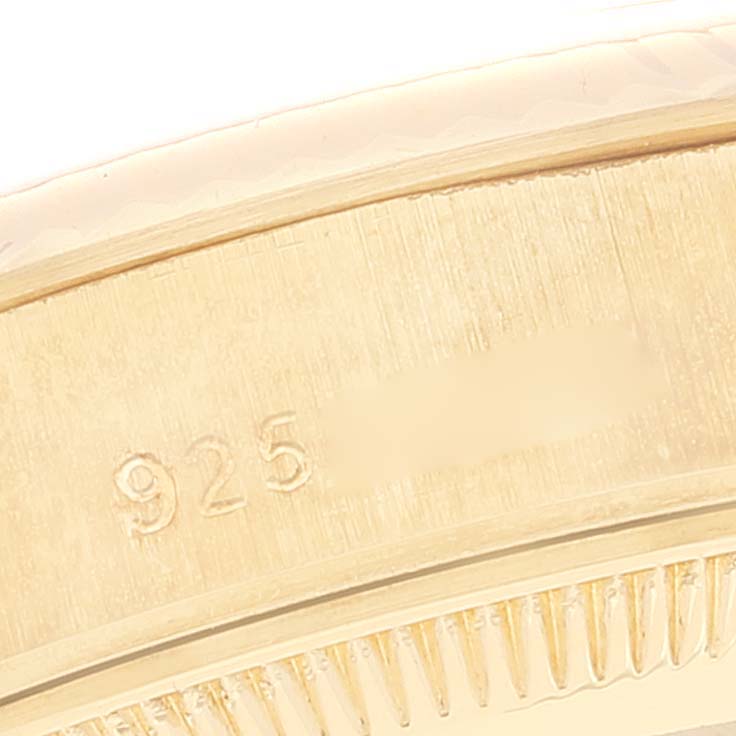This is a close-up of the side of a Rolex President 69178 Women
s Yellow Gold Champagne Dial 69178 Women
s Yellow Gold Champagne Dial model watch, showing its casing with engraved numbers.