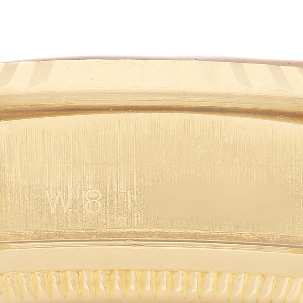 The image shows a close-up of the side of a Rolex President 18238 Men's Yellow Gold Champagne Dial model, focusing on the edge with visible engravings.