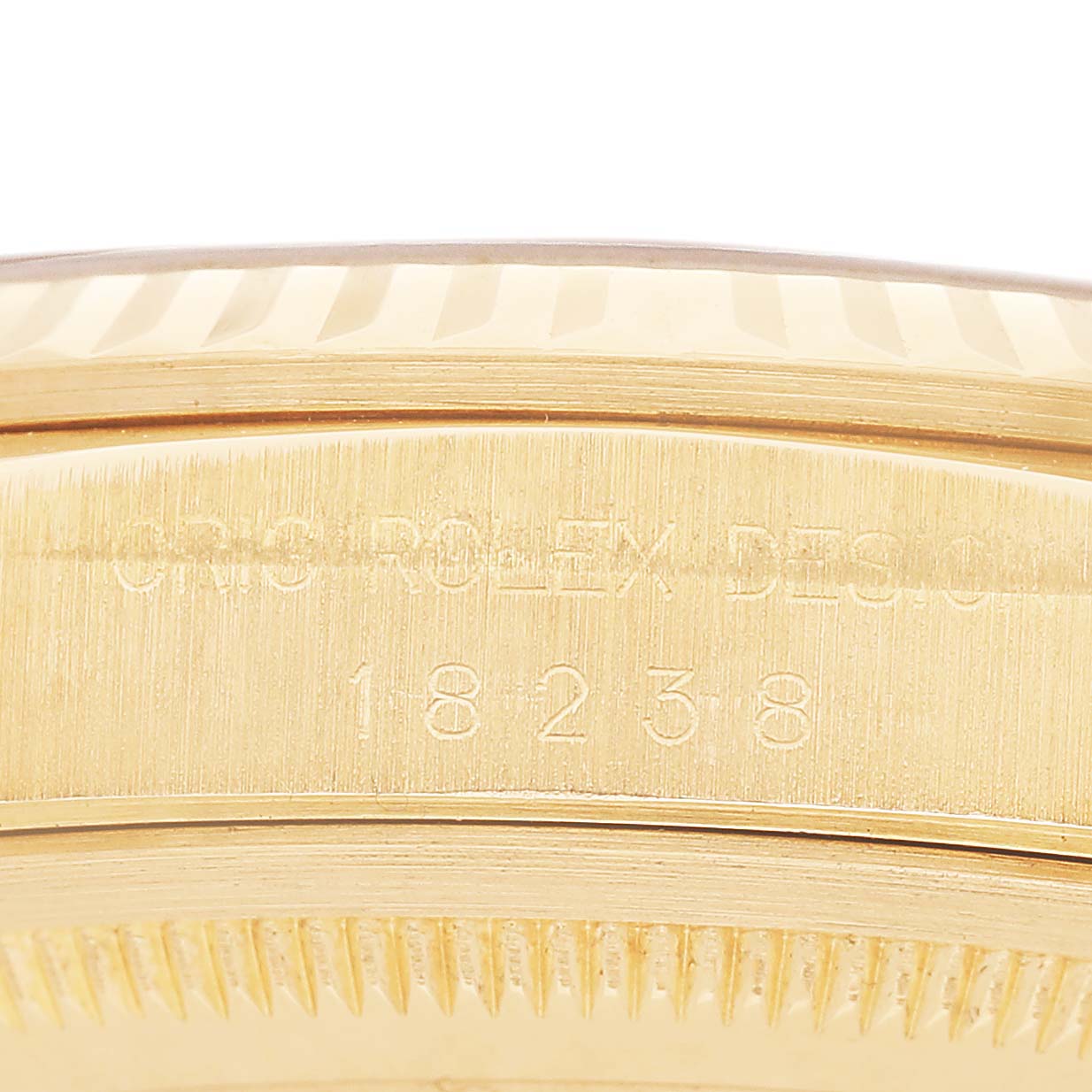 The image shows the engraved side case of a Rolex President 18238 Men's Yellow Gold Champagne Dial model, displaying the reference number.