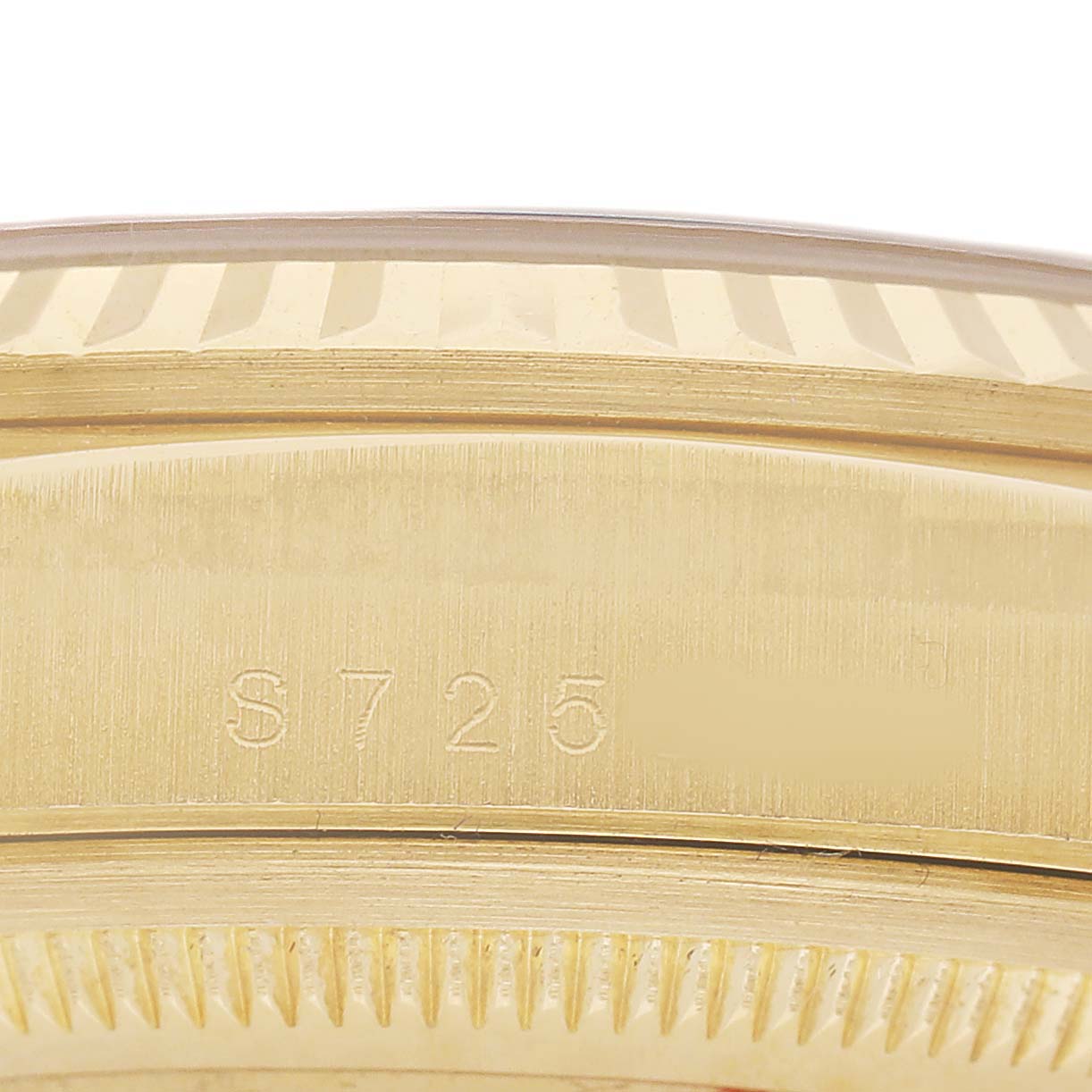 The image shows a close-up of the side of a Rolex President 18238 Men's Yellow Gold Champagne Dial model, focusing on the engraved bezel and edge.