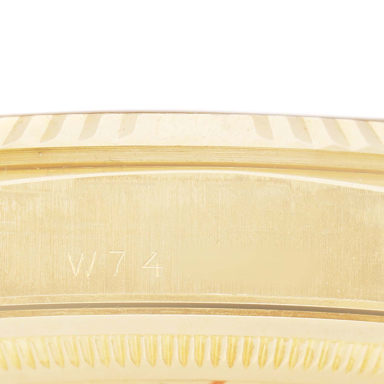 The image shows a close-up of the side and bezel of a Rolex President 18238 Men's Yellow Gold White Dial model, with engraved details visible.
