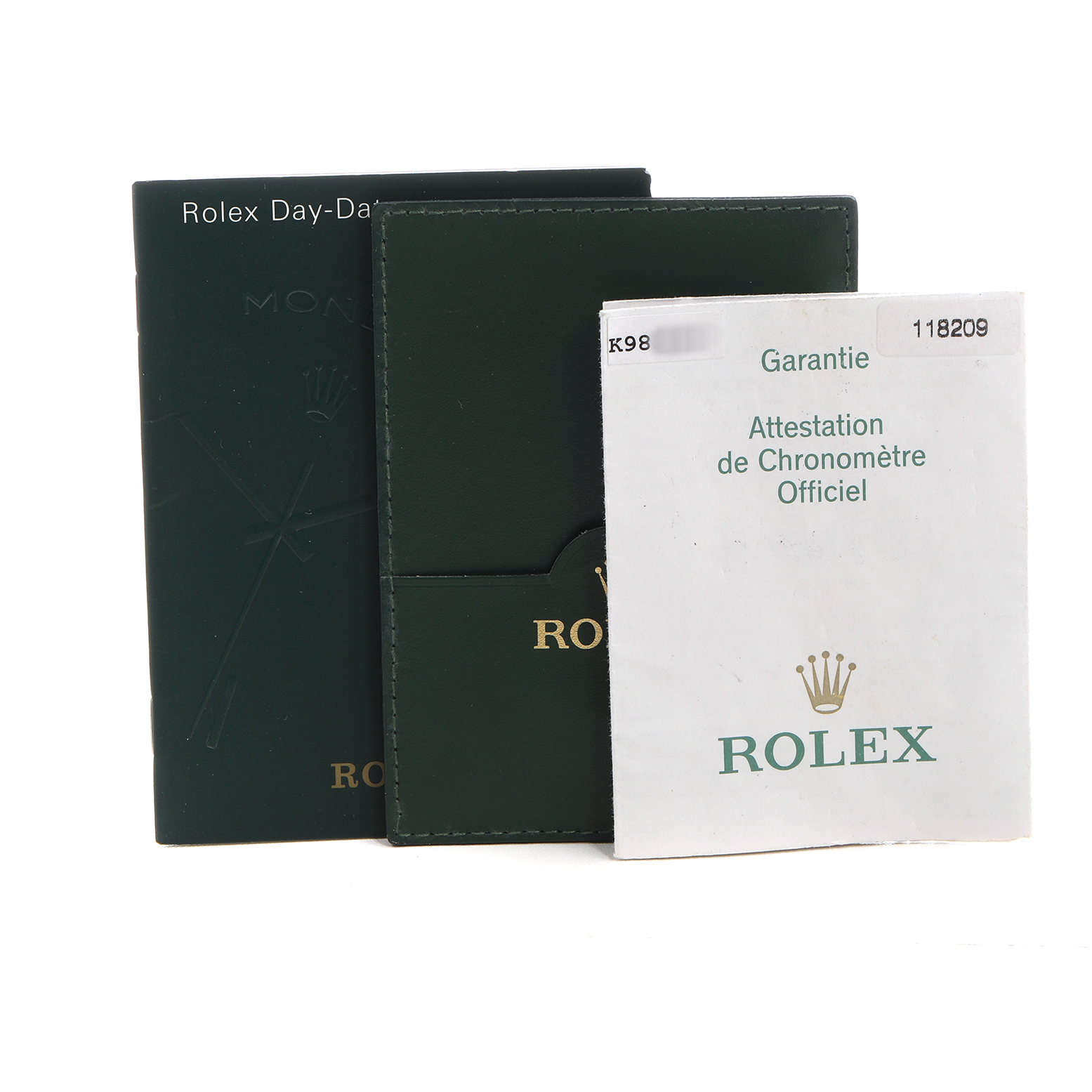 The image shows Rolex President 118209 Men's White Gold Silver Dial model watch accessories, including a warranty card and booklet, viewed from the front.
