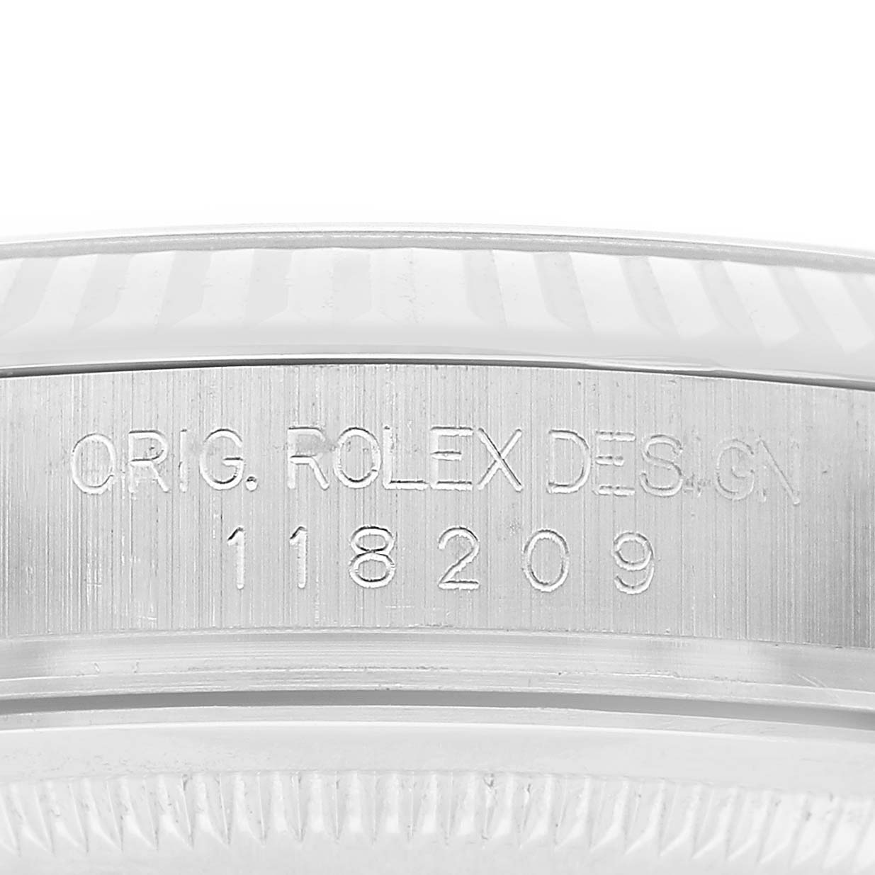 The image shows a close-up of the case side with model engraving on the Rolex President 118209 Men's White Gold Silver Dial watch.