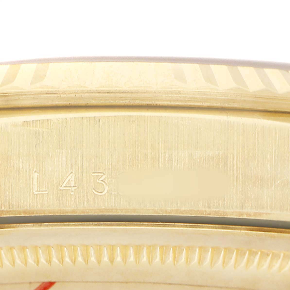 The image shows a close-up of the case side with engraving, edges, and bezel detail of a Rolex President 18238 Men's Yellow Gold Champagne Dial watch.