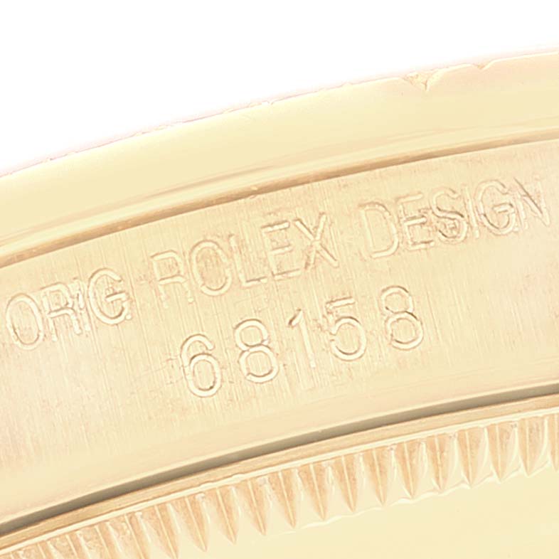 The image shows a close-up of the case back edge with the model number and engravings of a Rolex President 68158 Women
s Yellow Gold Champagne Dial 68158 Women
s Yellow Gold Champagne Dial watch.