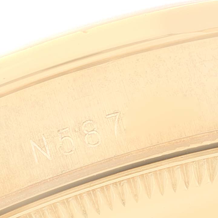 This image shows a close-up of the side engraving on the Rolex President 68158 Women
s Yellow Gold Champagne Dial 68158 Women
s Yellow Gold Champagne Dial model watch.