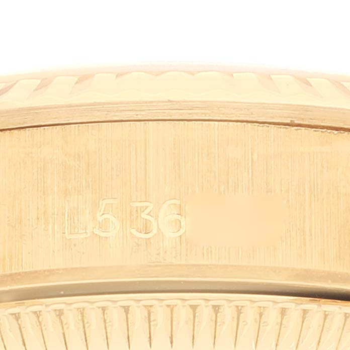 This image shows a close-up of the side engraving on the Rolex Pearlmaster 67198 Women
s Yellow Gold Black Dial 67198 Women
s Yellow Gold Black Dial watch
s case.