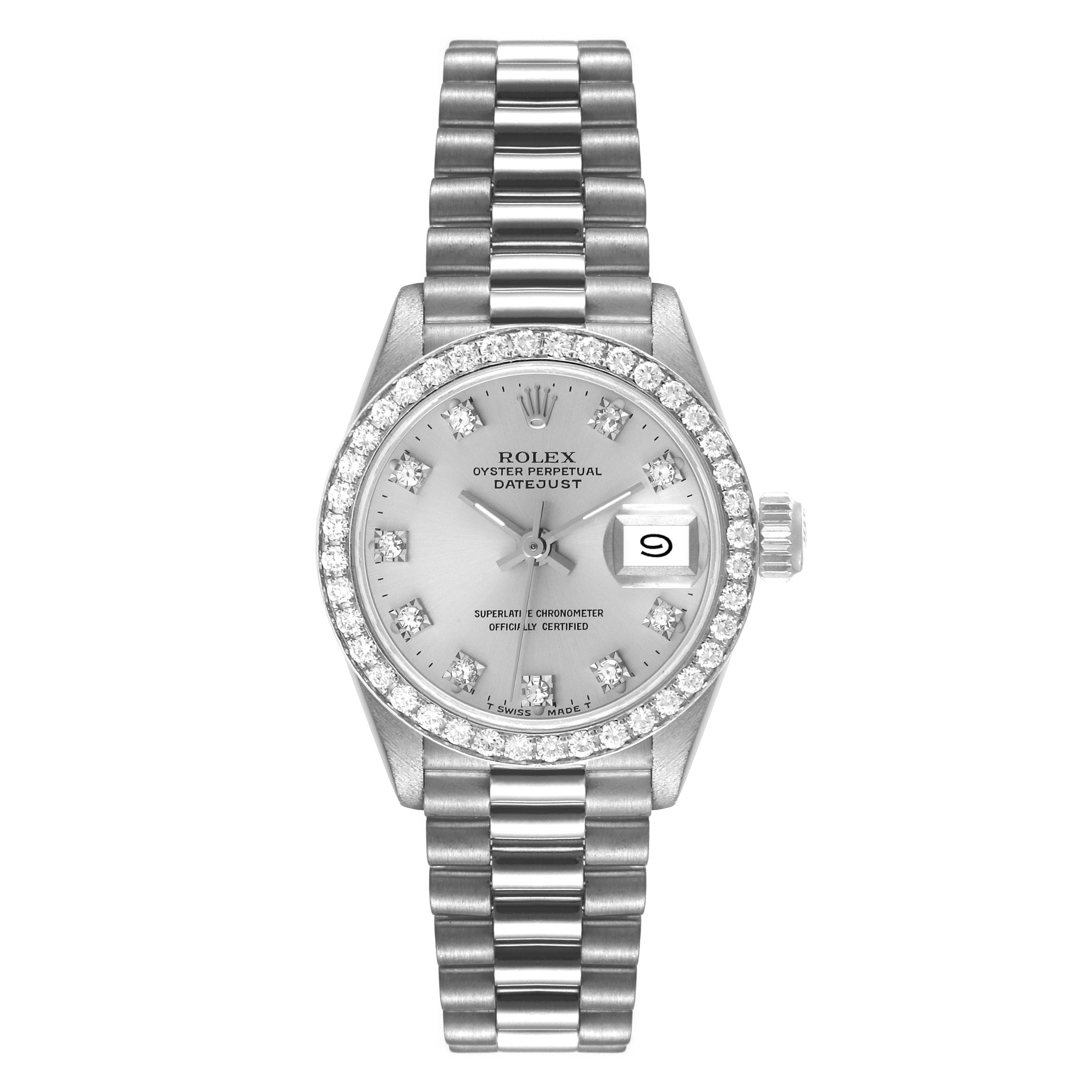 The President model Rolex watch is shown from a top-down angle, showcasing its dial, bezel, bracelet, and date window.