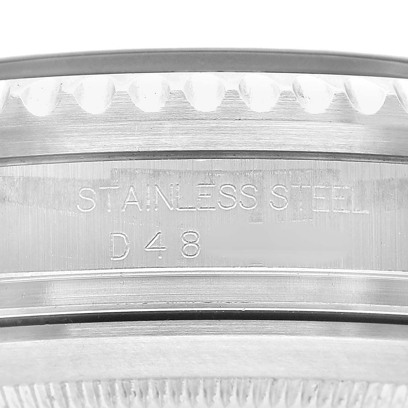 The image shows a close-up of the side edge of the Rolex Sea-Dweller 16600 Men's Stainless Steel Black Dial, highlighting the "STAINLESS STEEL" engraving.