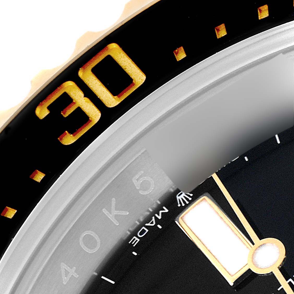 The image shows a close-up of the bezel, minute hand, and part of the dial of a Rolex Sea-Dweller 126603 Men's Steel and Gold (two tone) Black Dial 126603 Men's Steel and Gold (two tone) Black Dial watch.