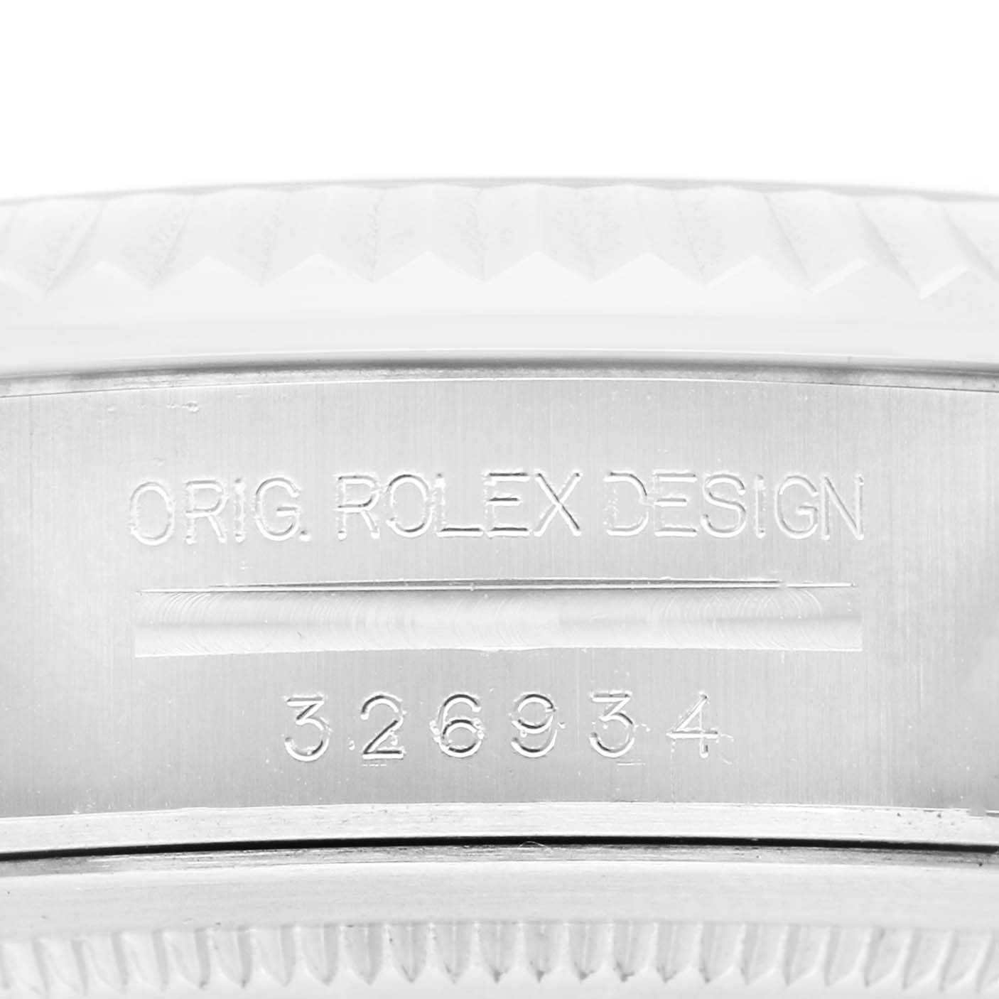 The image shows a close-up of the side of a Rolex Sky-Dweller 326934 Men's Stainless Steel Blue Dial with visible serial and model engravings.