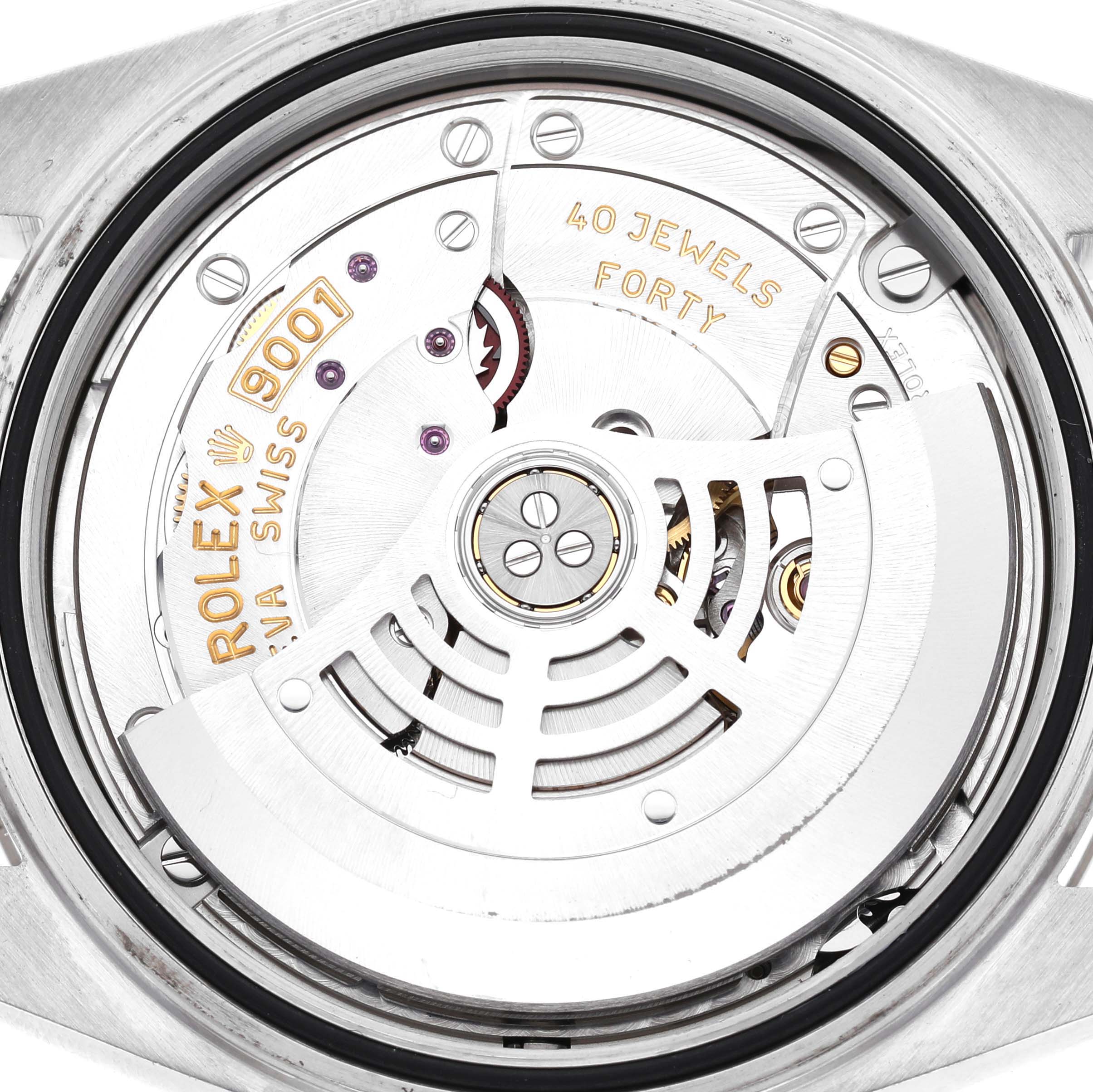 The image shows a close-up of the movement of a Rolex Sky-Dweller 326934 Men's Stainless Steel Blue Dial, highlighting the rotor and internal mechanisms.