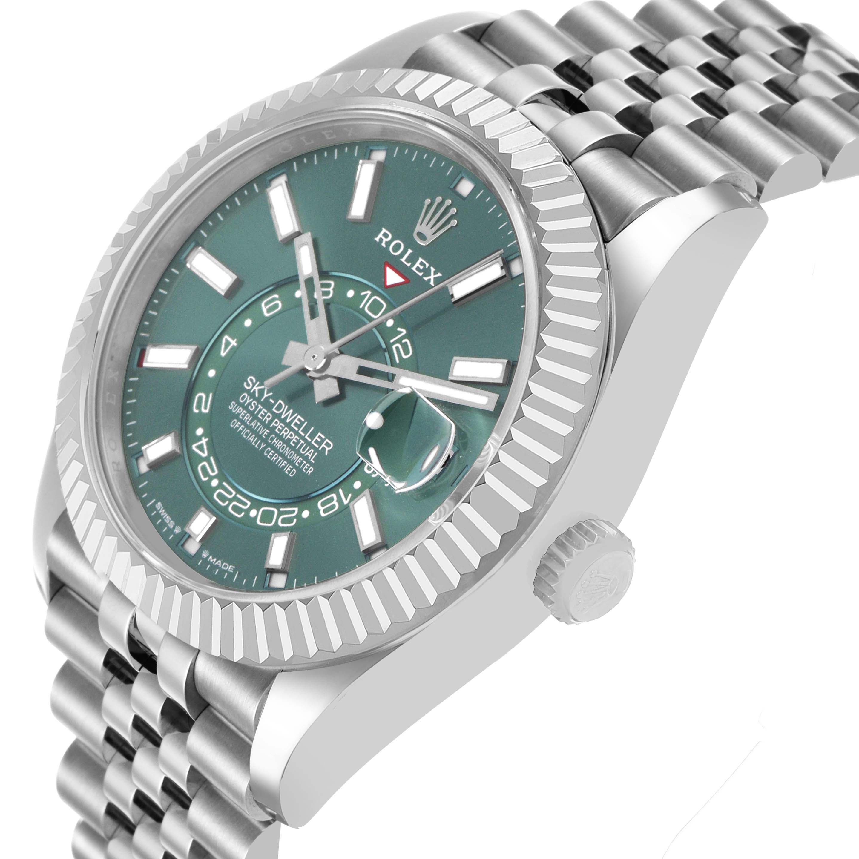 The Rolex Sky-Dweller 336934 Men's Stainless Steel Green Dial is shown at a tilted angle, highlighting the case, dial, bezel, and part of the bracelet.