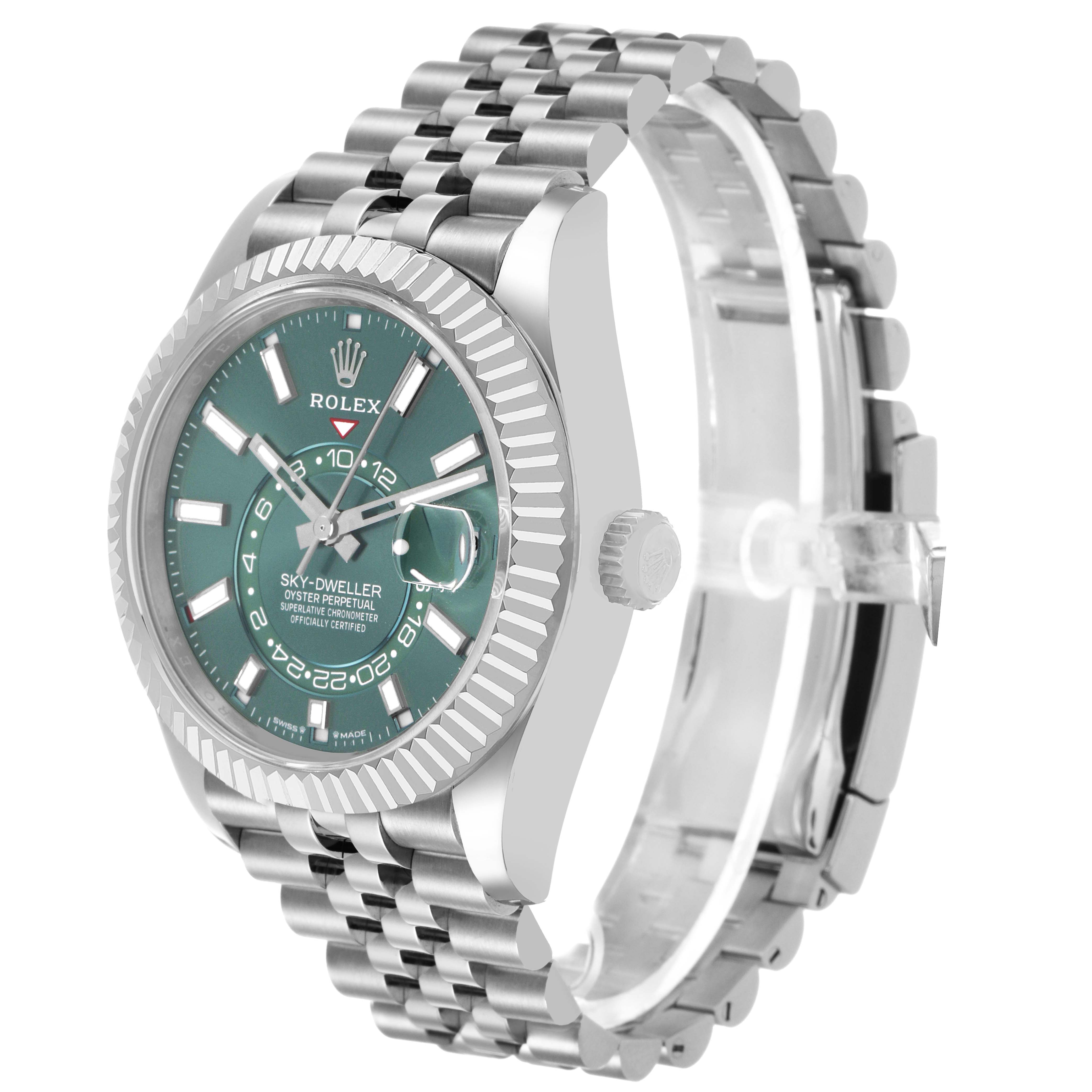 The Rolex Sky-Dweller 336934 Men's Stainless Steel Green Dial watch is shown at an oblique angle, displaying its face, bezel, crown, and partially open bracelet.