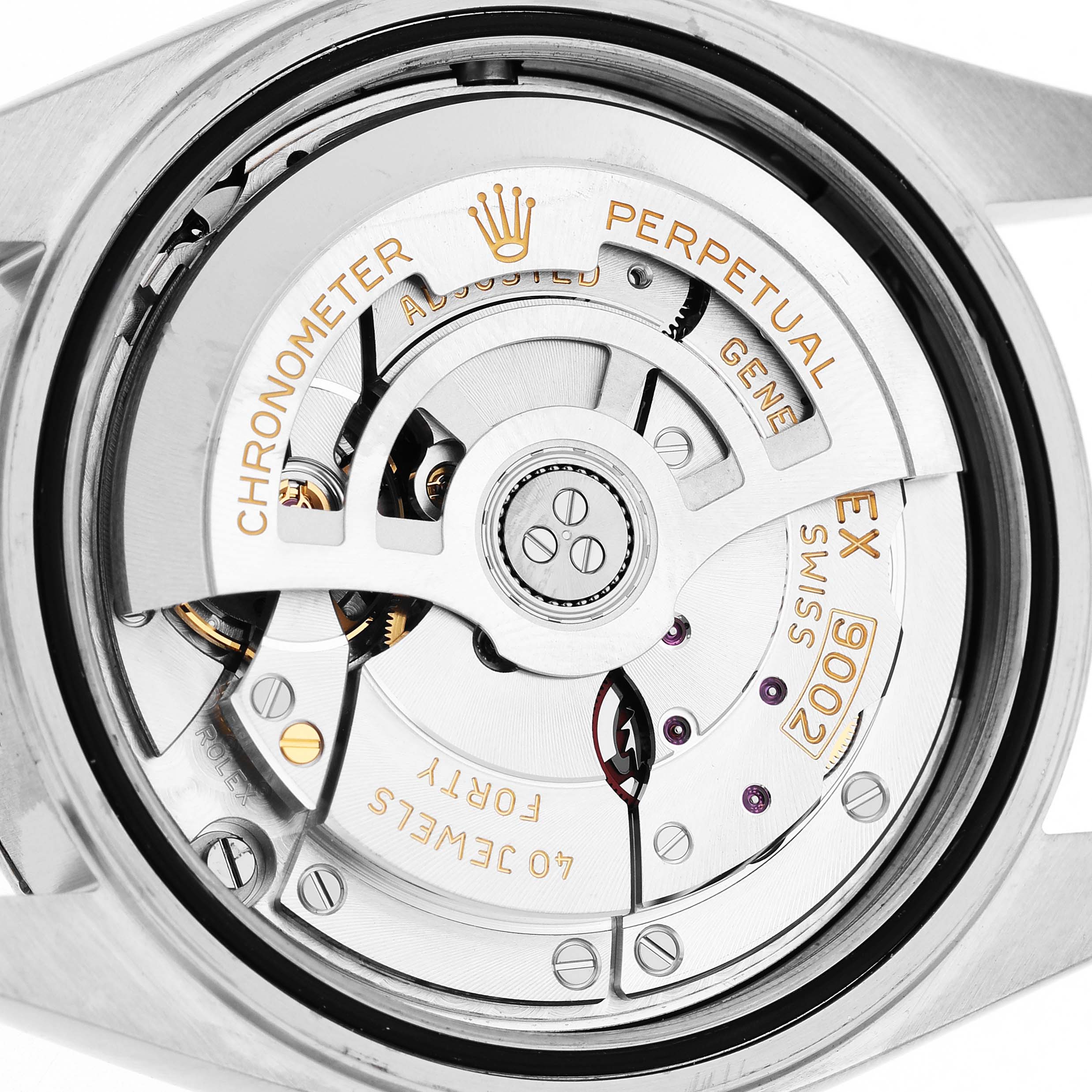 The image shows the movement of a Rolex Sky-Dweller 336934 Men's Stainless Steel Green Dial, highlighting the automatic rotor and intricate gears.