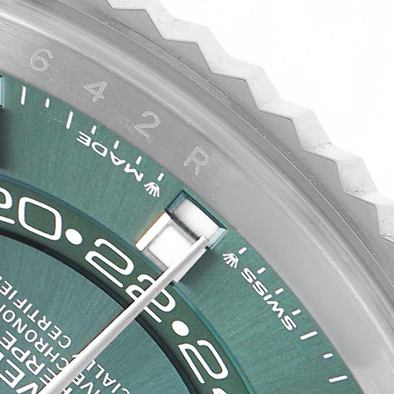 The image shows a close-up of the bezel and part of the dial on a Rolex Sky-Dweller 336934 Men's Stainless Steel Green Dial, highlighting the numbers and markers.