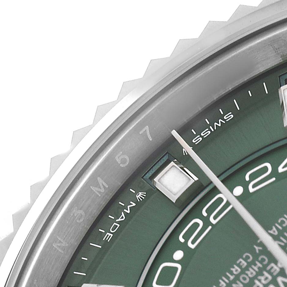 The image shows the bezel and partial green dial of a Rolex Sky-Dweller 336934 Men's Stainless Steel Green Dial, highlighting the month and minute markers.