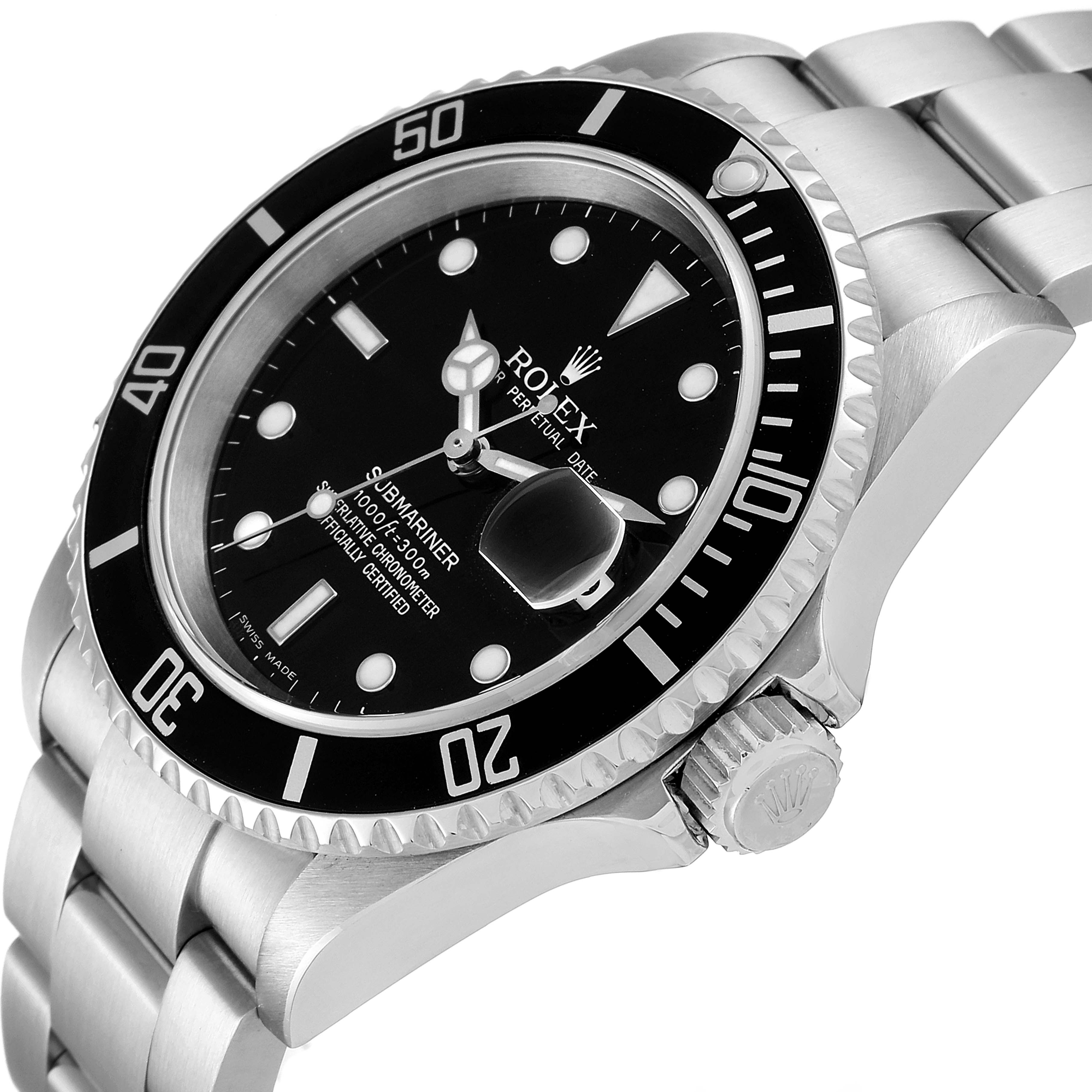 This is an angled view of a Rolex Submariner 16610 Men's Stainless Steel Black Dial 16610 Men's Stainless Steel Black Dial showing the dial, bezel, and part of the bracelet and crown.