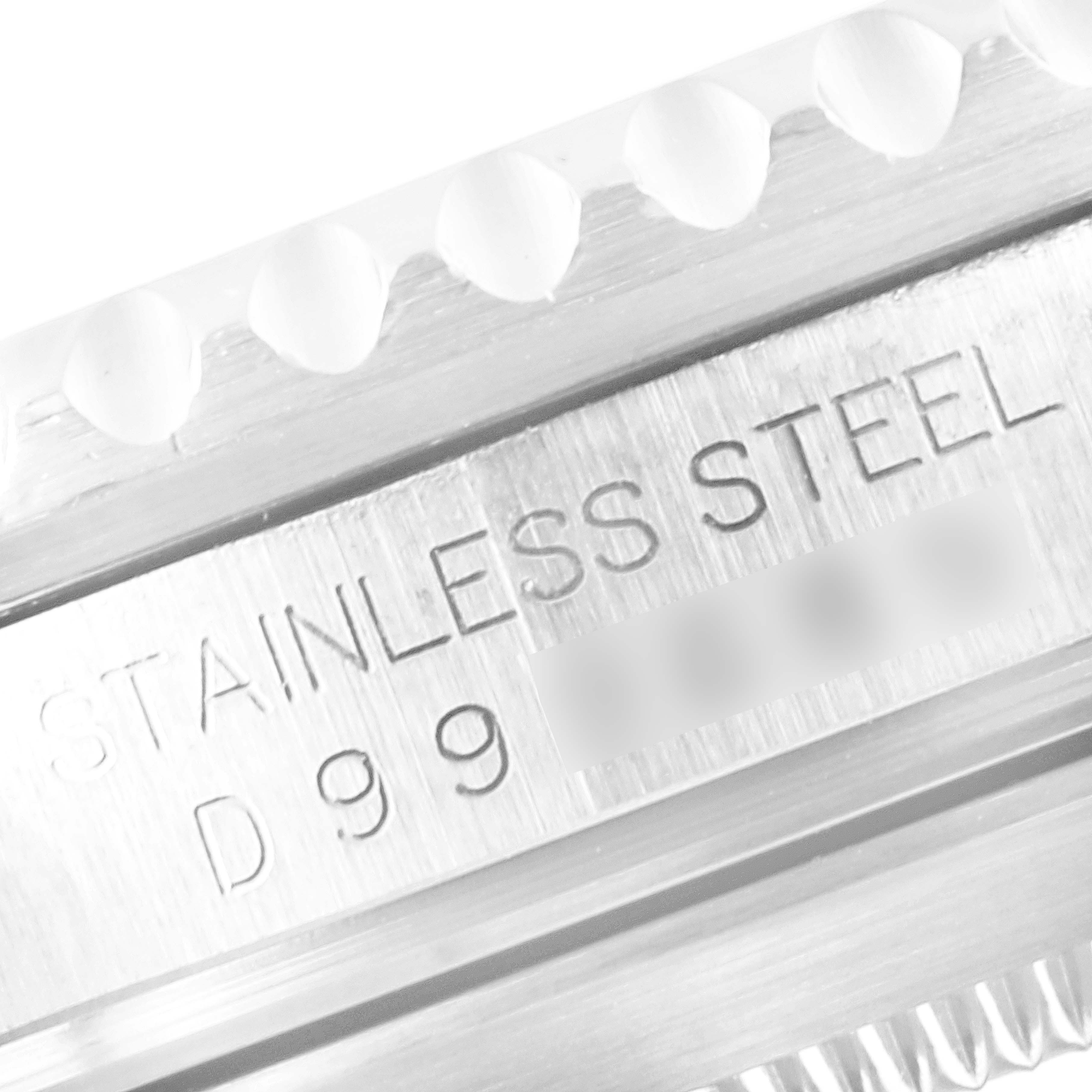 This close-up shows the stainless steel engraving and part of the bezel of the Rolex Submariner 16610 Men's Stainless Steel Black Dial 16610 Men's Stainless Steel Black Dial watch.