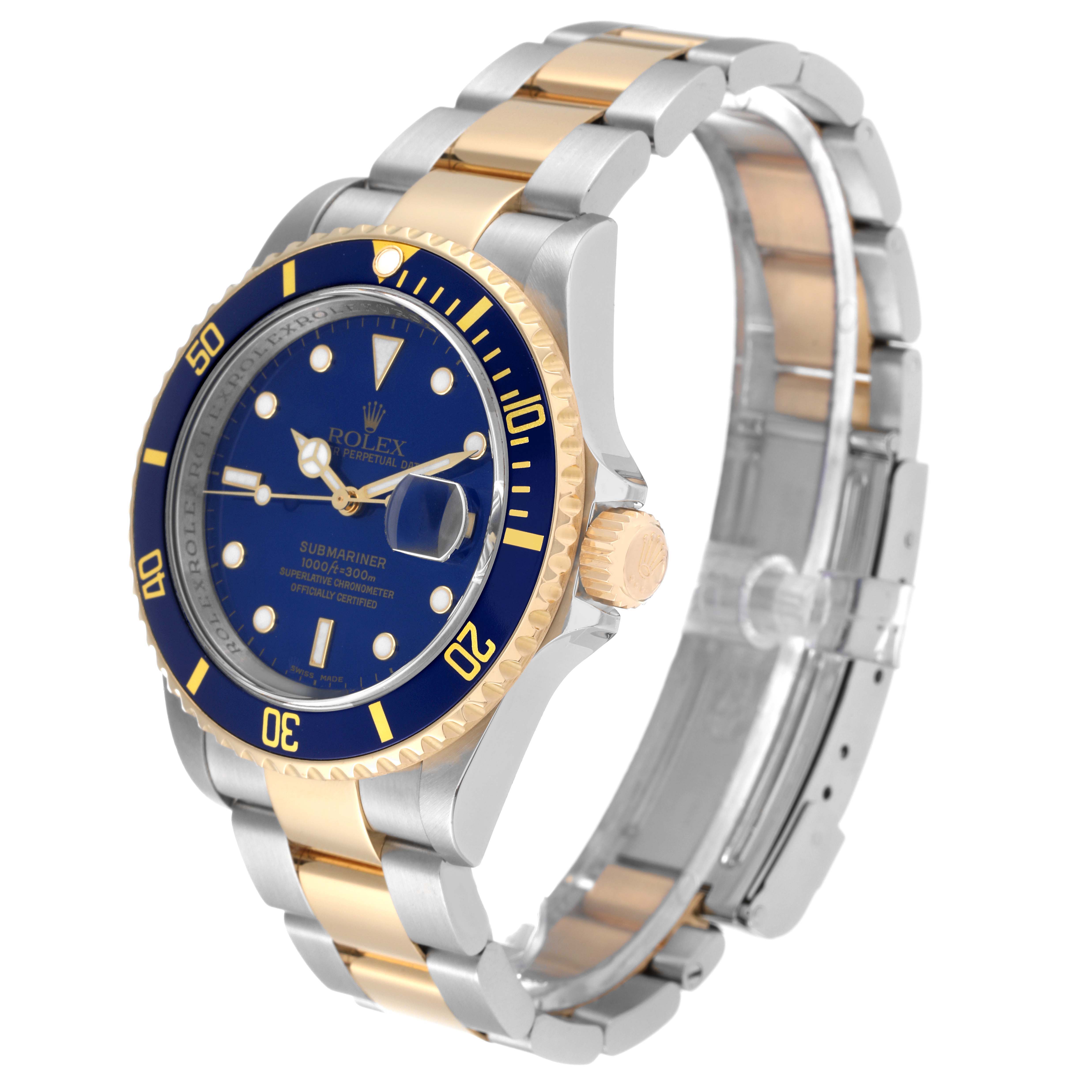 The image shows a Rolex Submariner 16613 Men's Steel and Gold (two tone) Blue Dial 16613 Men's Steel and Gold (two tone) Blue Dial watch at an angled side view, highlighting its blue dial, gold bezel, and two-tone bracelet.