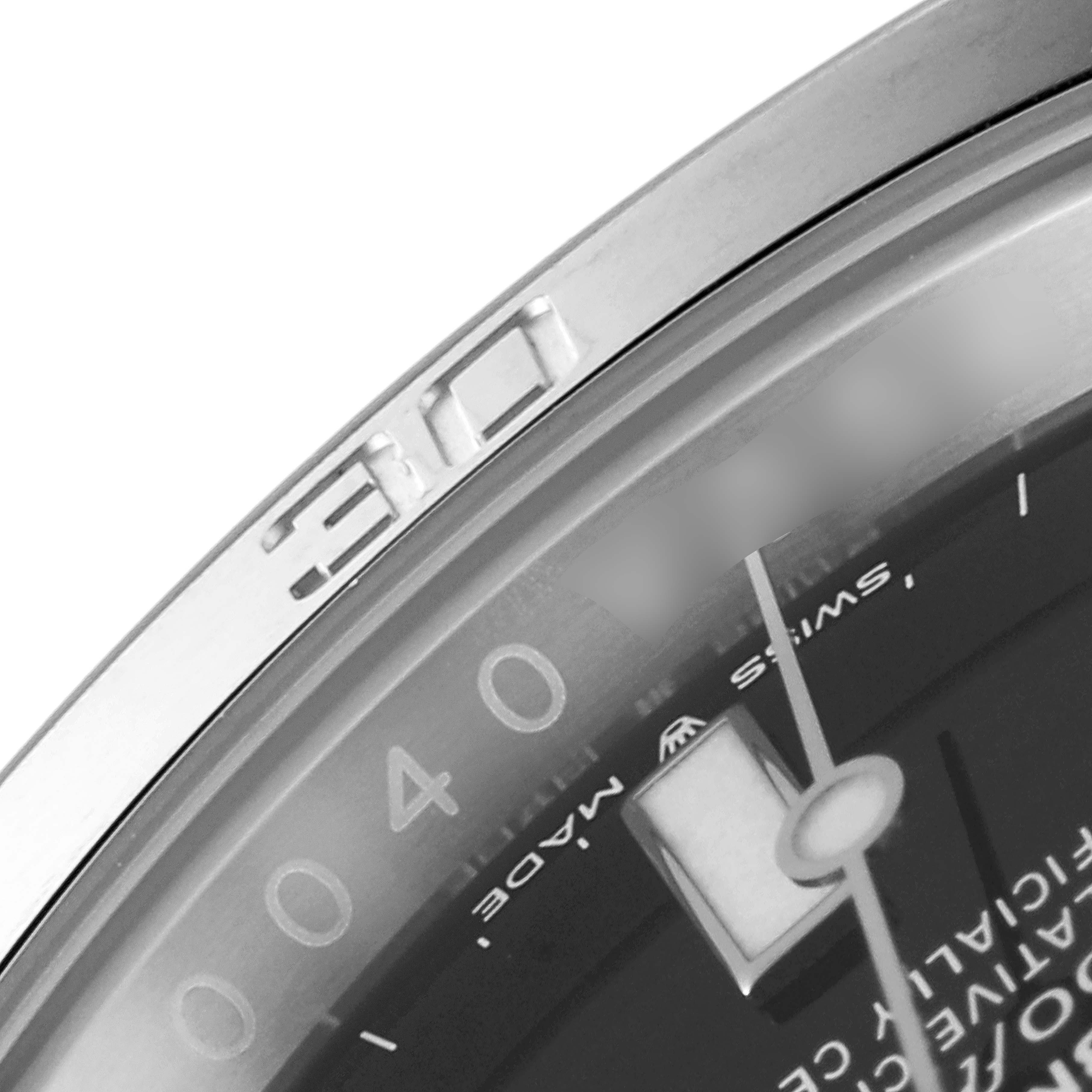 The image shows a close-up angle of the bezel, minute markings, and part of the dial of a Rolex Submariner 126610LN Men
s Stainless Steel Black Dial 126610LN Men
s Stainless Steel Black Dial watch.
